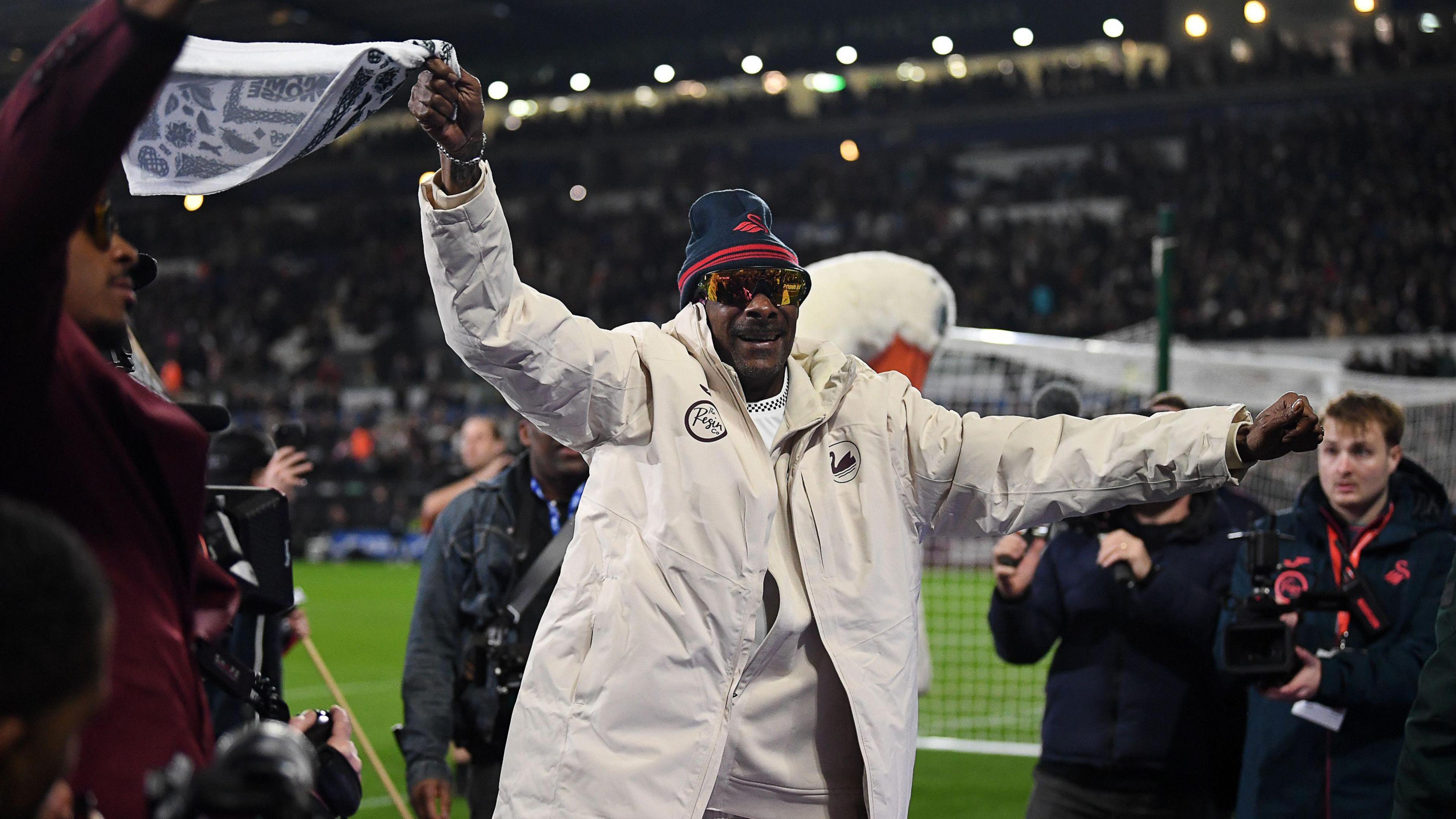 Snoop Dogg waves a towel before Swansea's draw with Preston 