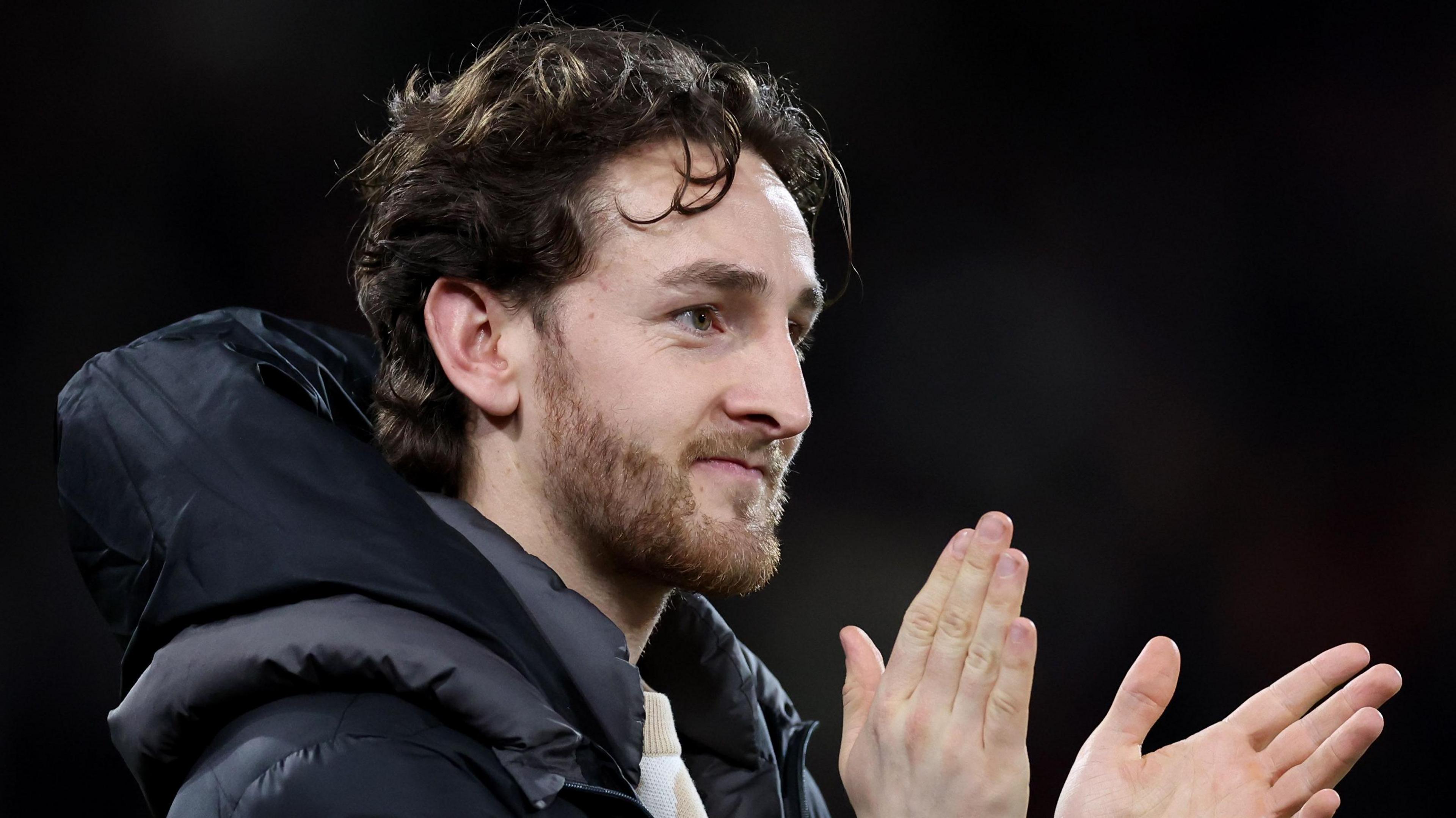 Luton captain Tom Lockyer applauds fans