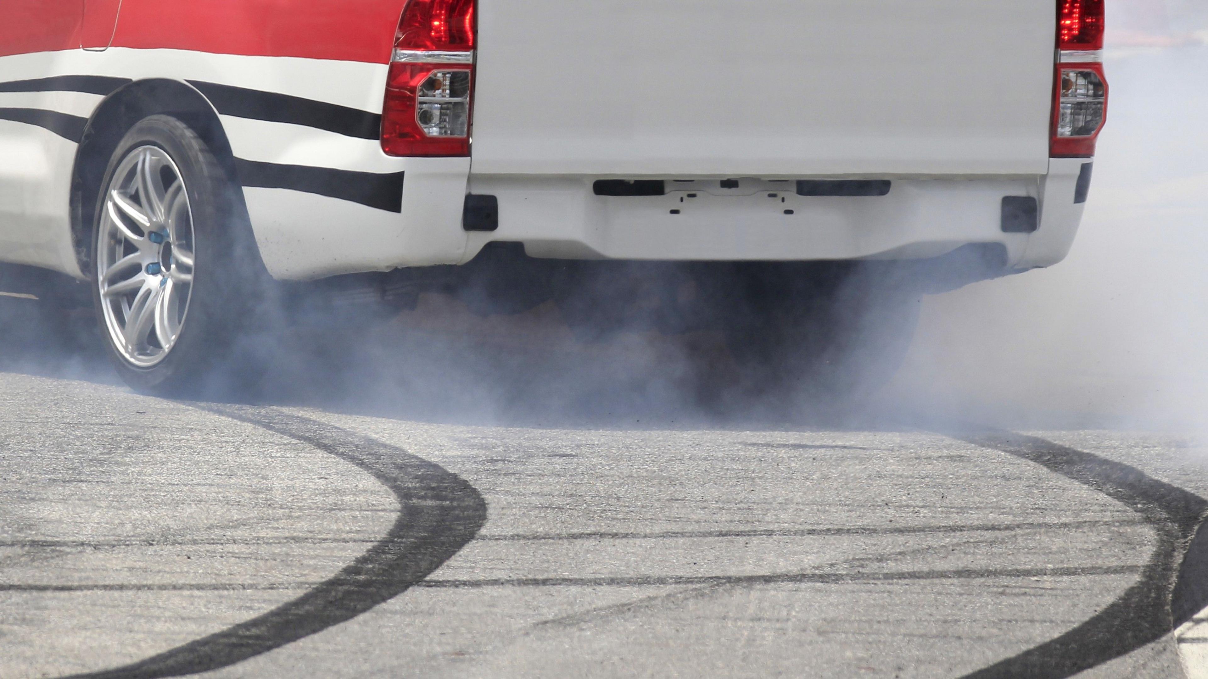 A car leaves skid marks on a road