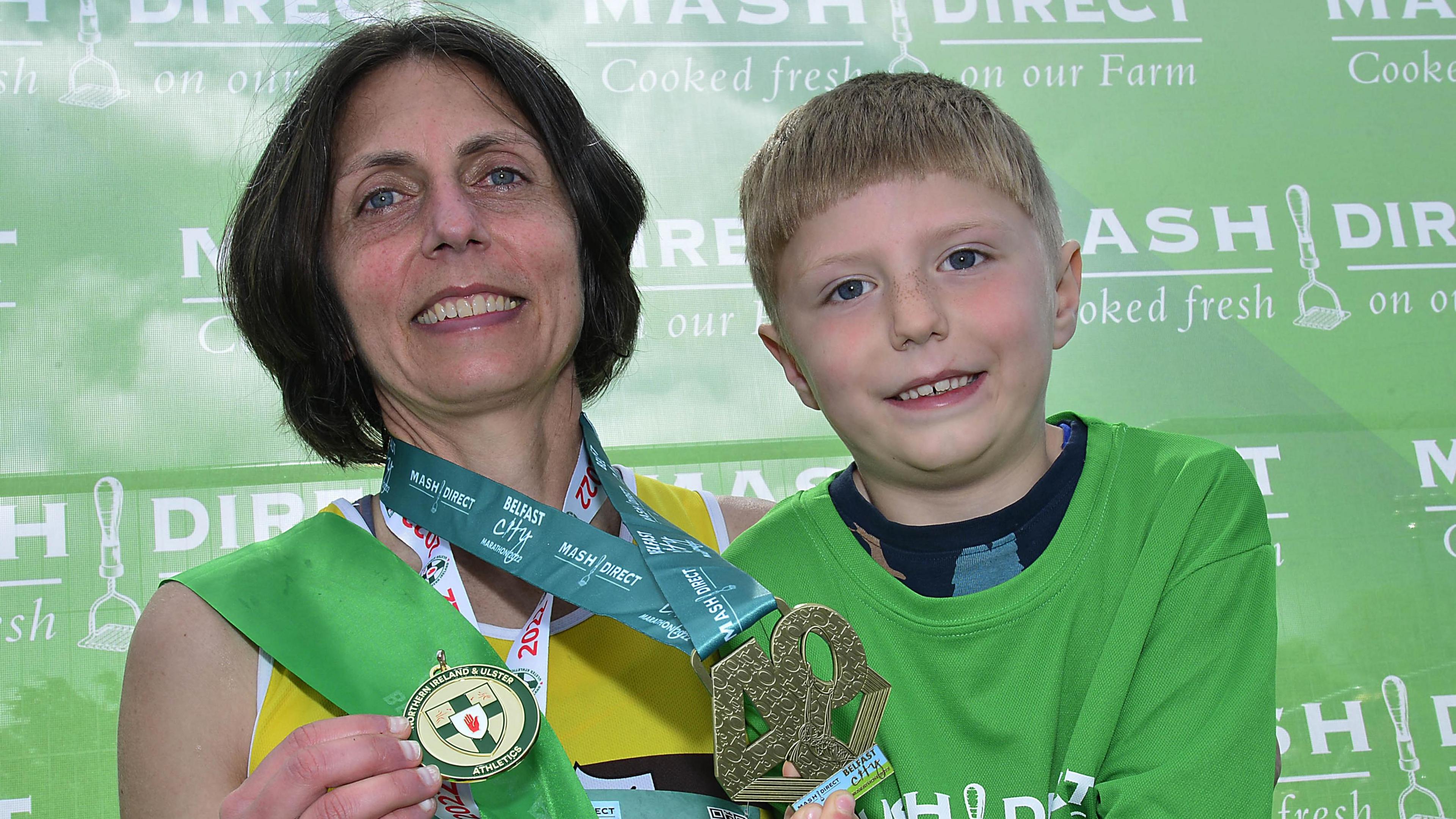 Winner of the women's race Gladys Daniel pictured with her six-year-old son Ronan 