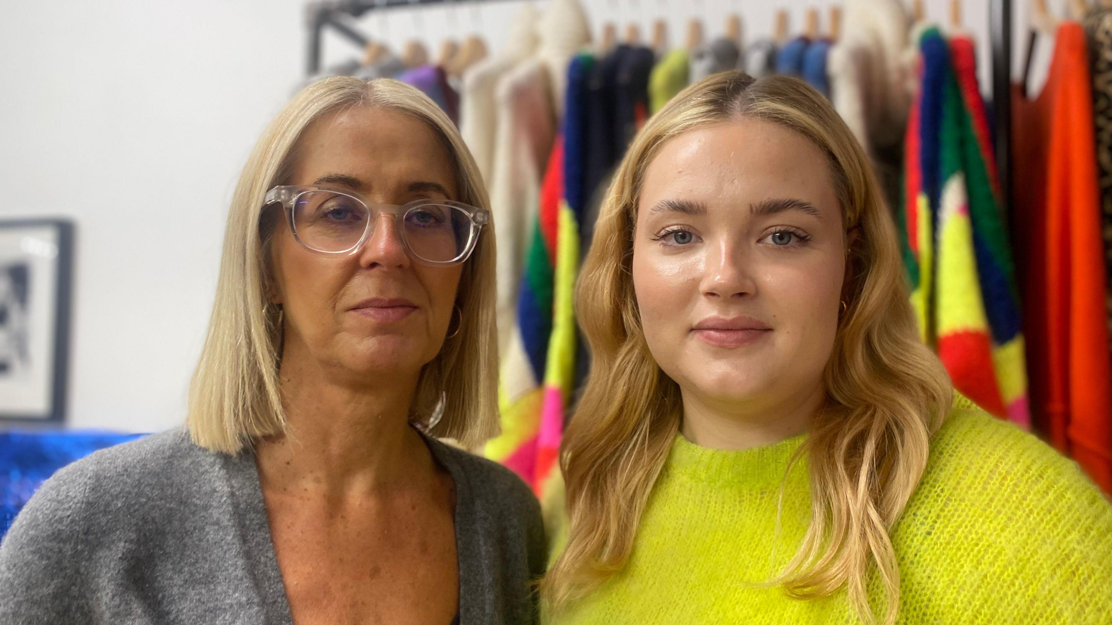 Sally and Ellie Longdon wearing a grey cardigan and a bright green top respectively