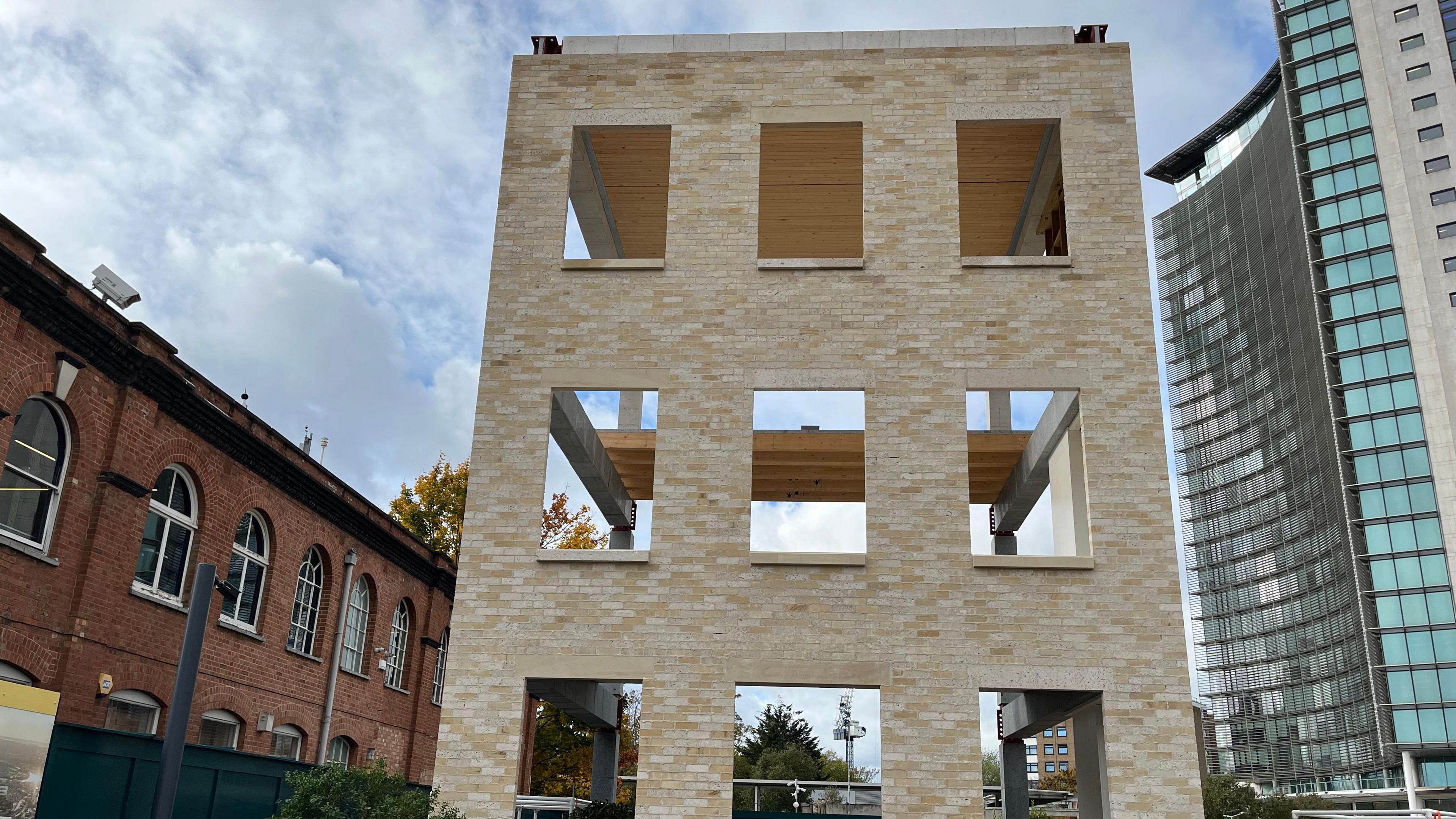 The wall stands incomplete