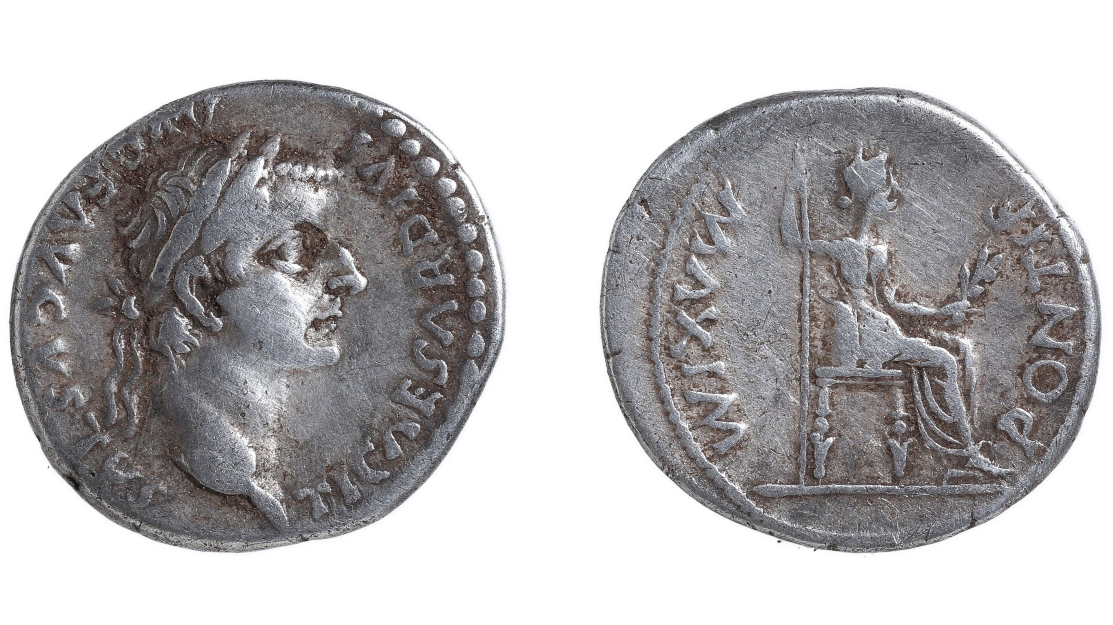 Two views of a Roman silver denarius. On the left it shows a bust of Tiberius and around the edge of the coin are Latin words. To the right it shows a woman's figure sitting on a chair in profile, with more Latin words around the edge of the coin.