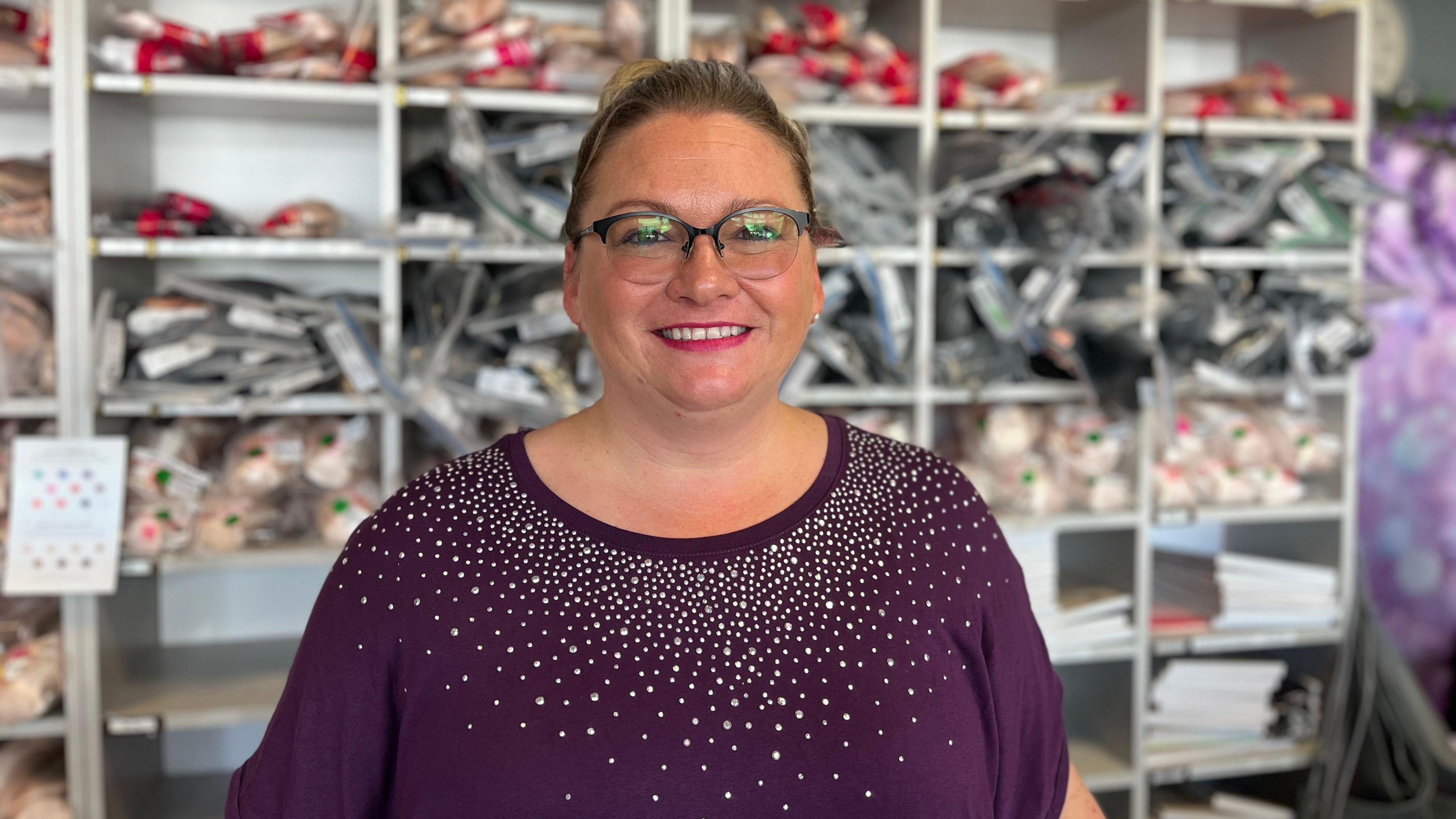 Lucy Newton, owner of Lulu's Dance and Activewear, standing in her shop 