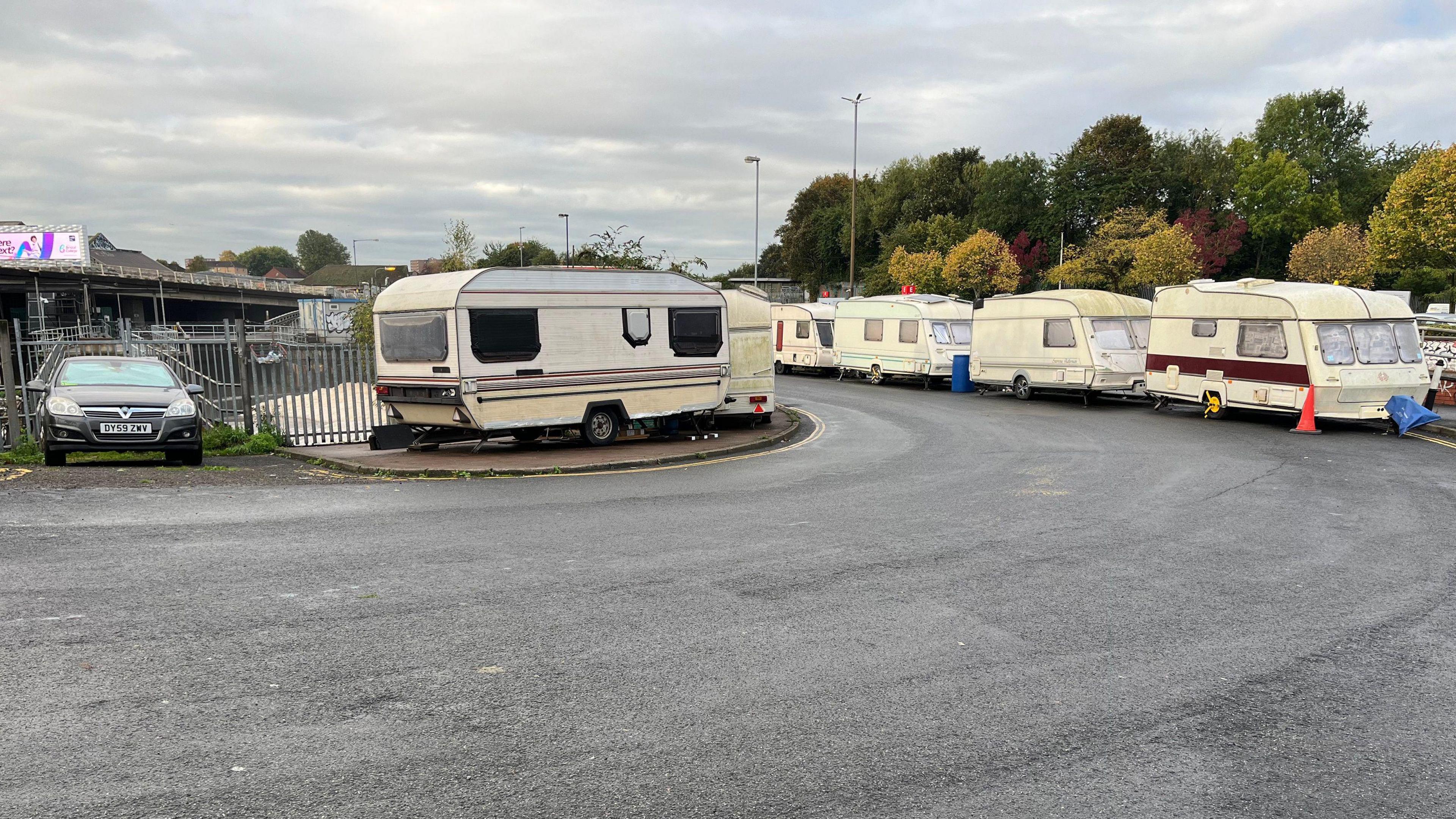 Caravans seen parked up along the road near the M32. 