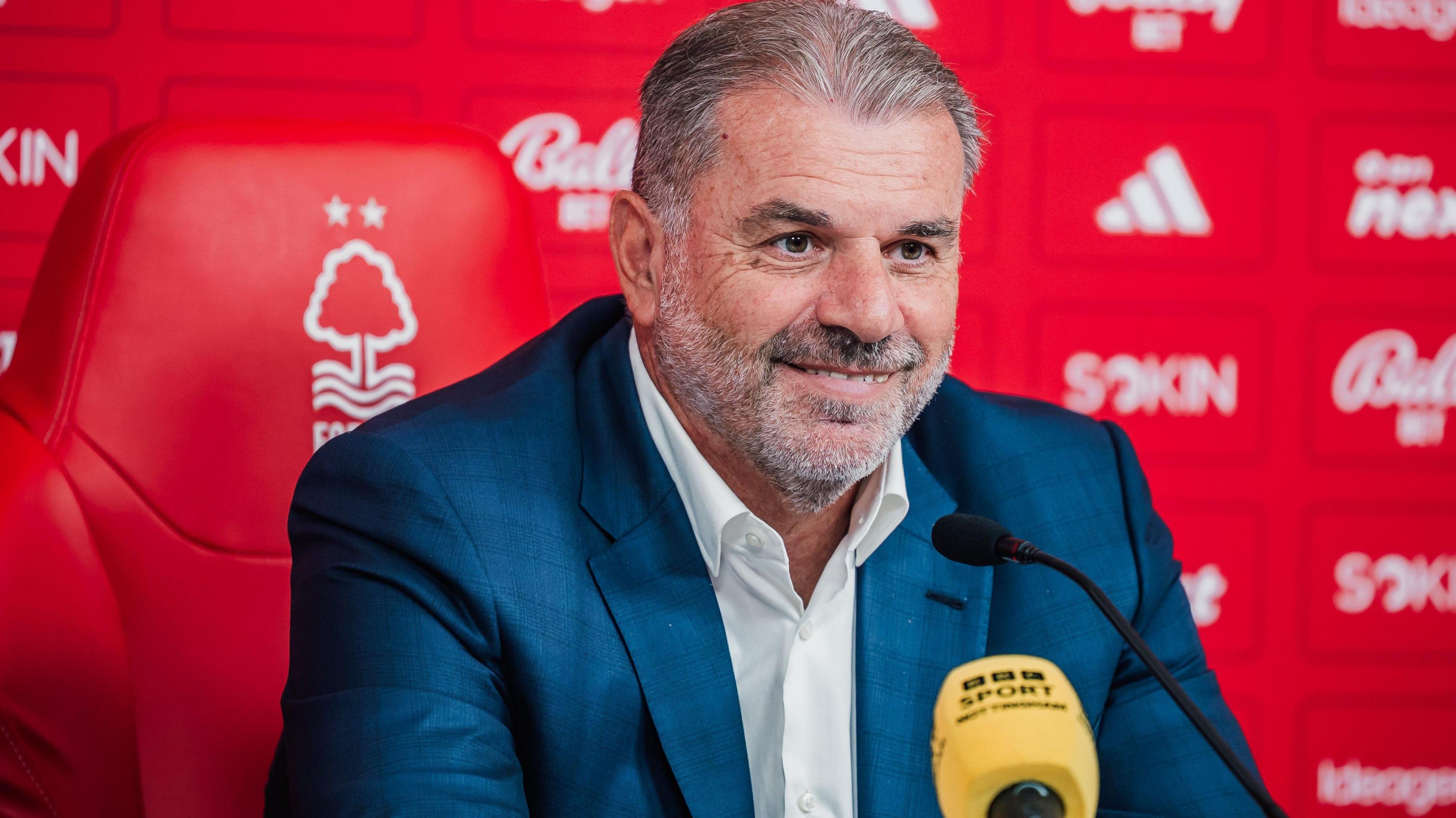 Ange Postecoglou in front of a yellow BBC Sport microphone