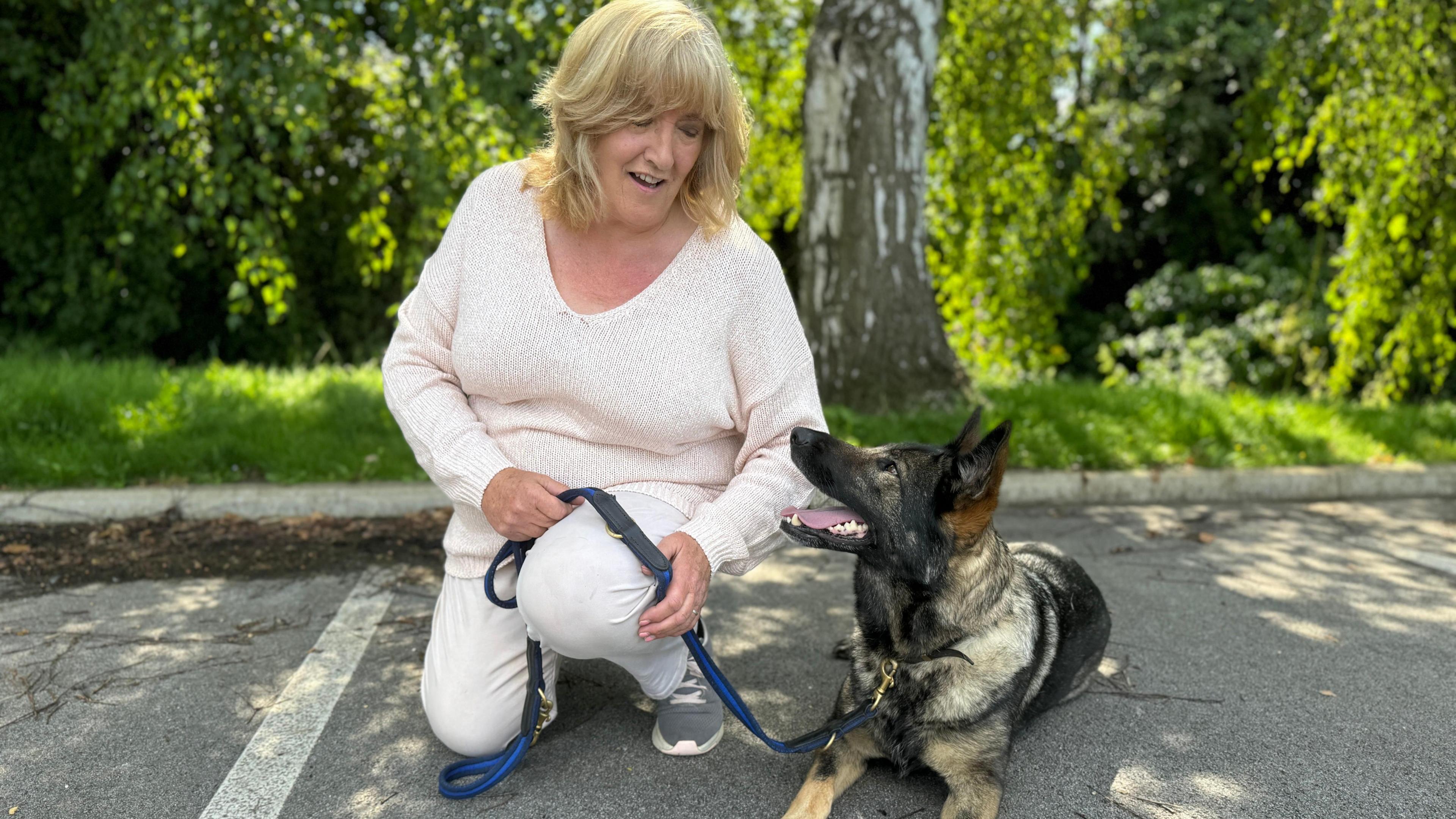 Averil Dongworth with her German shepherd 