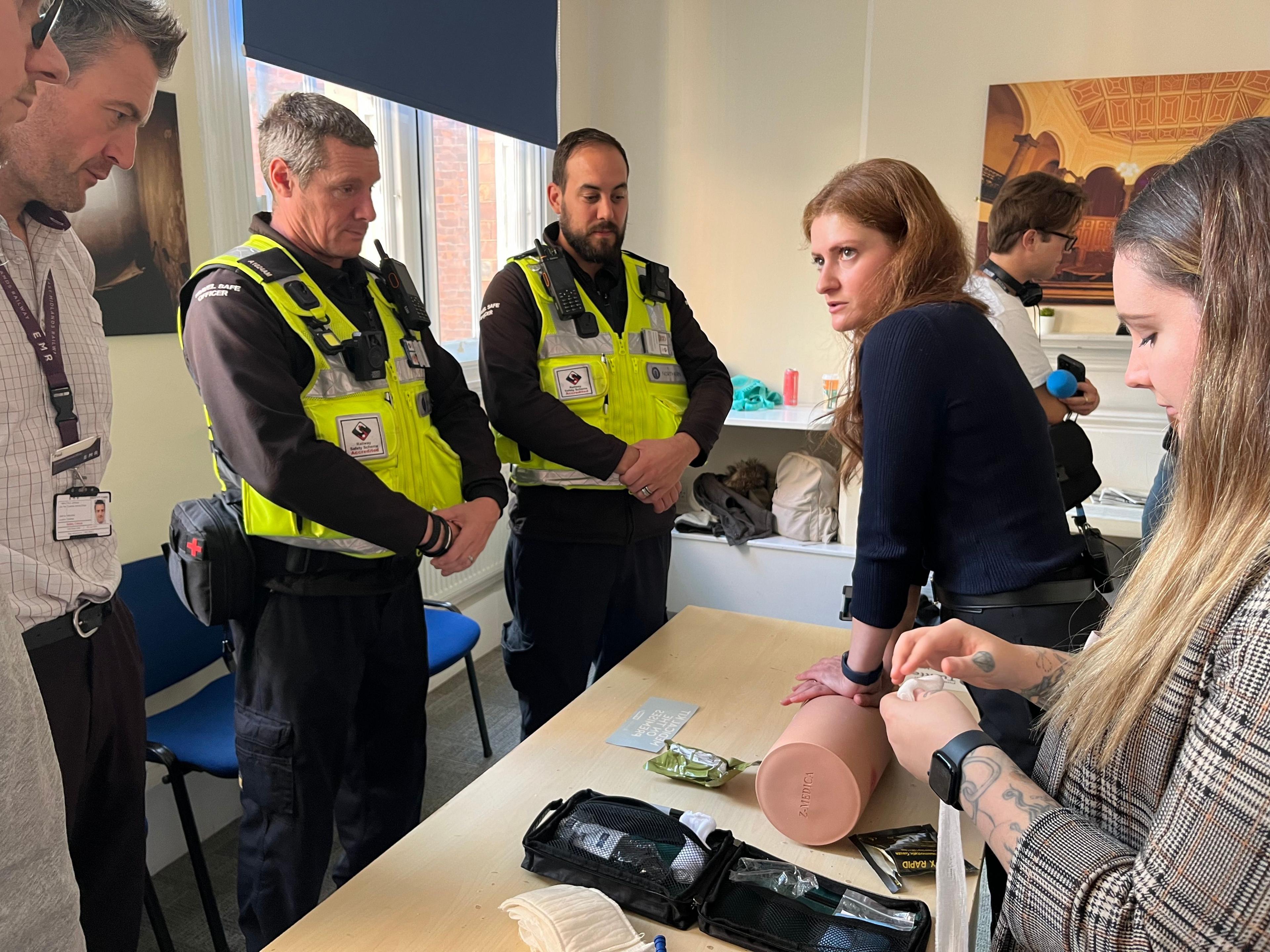 Elena demonstrating a life-saving technique to help victims who have been involved in a stabbing