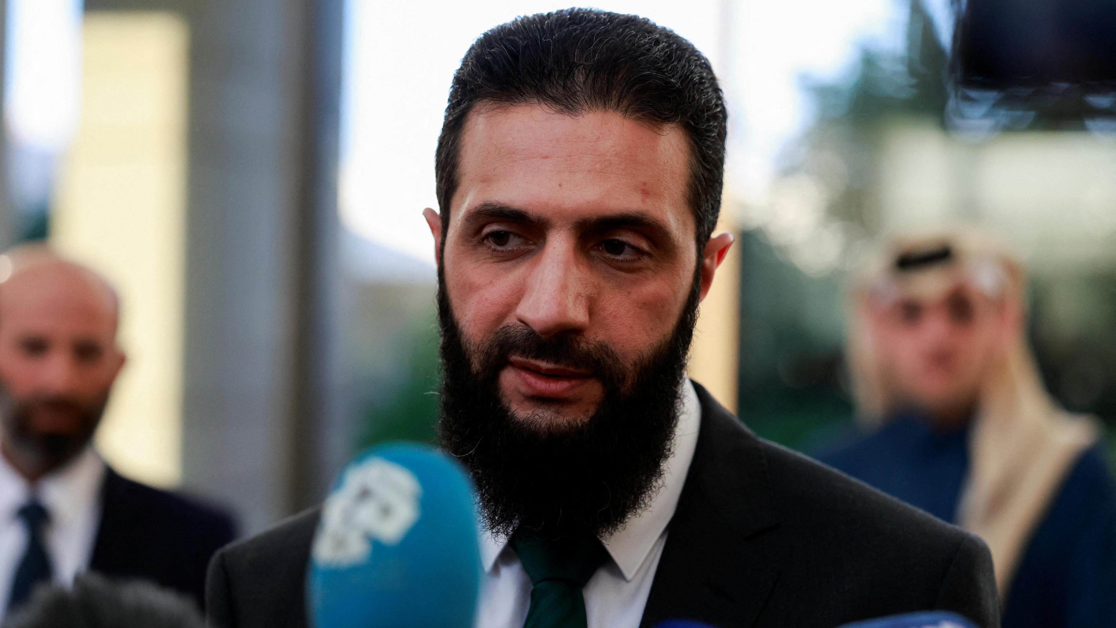 Ahmed al-Sharaa speaks at a news conference in Damascus, Syria (23 December 2024)