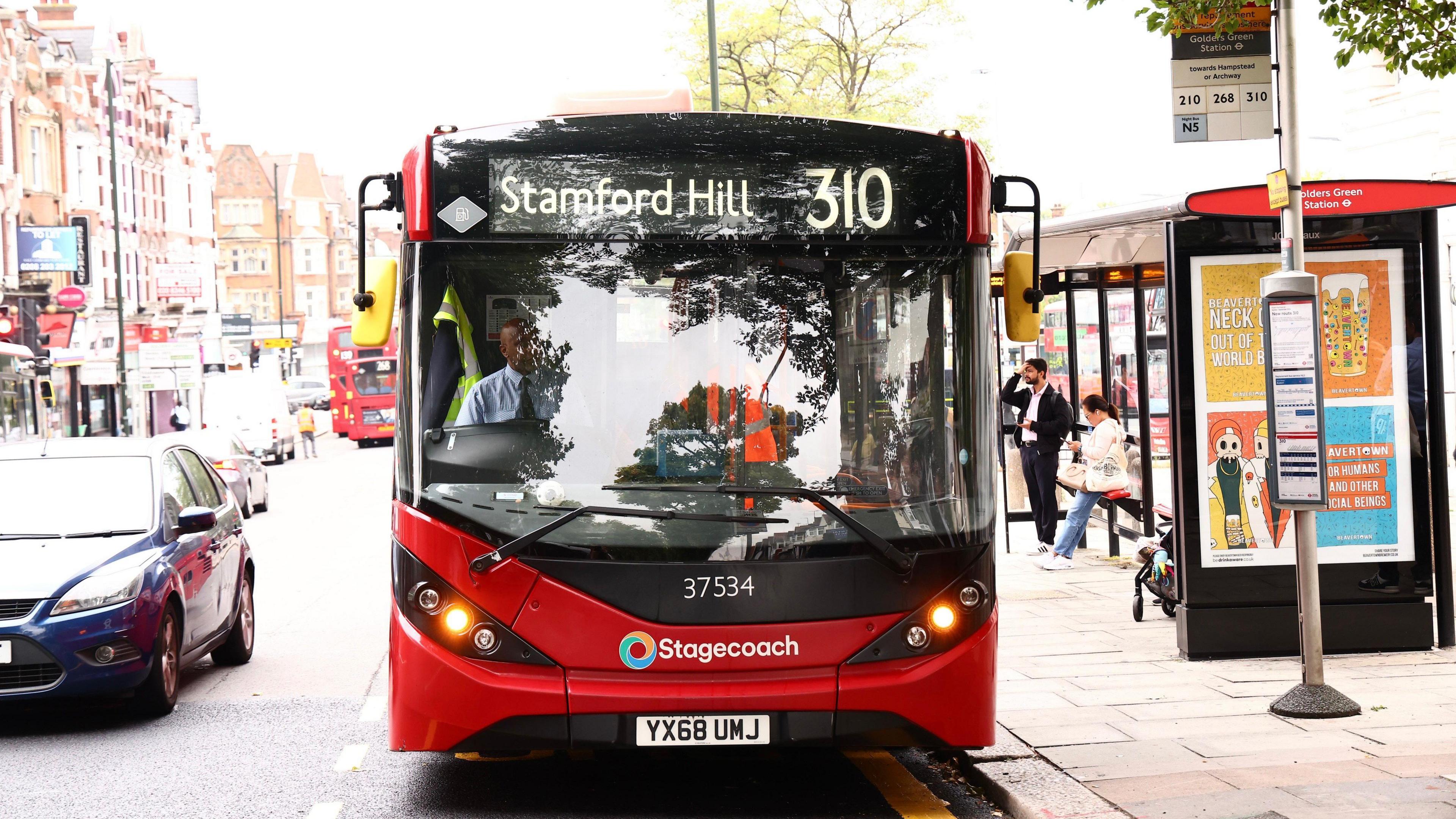 The 310 bus at a bus stop