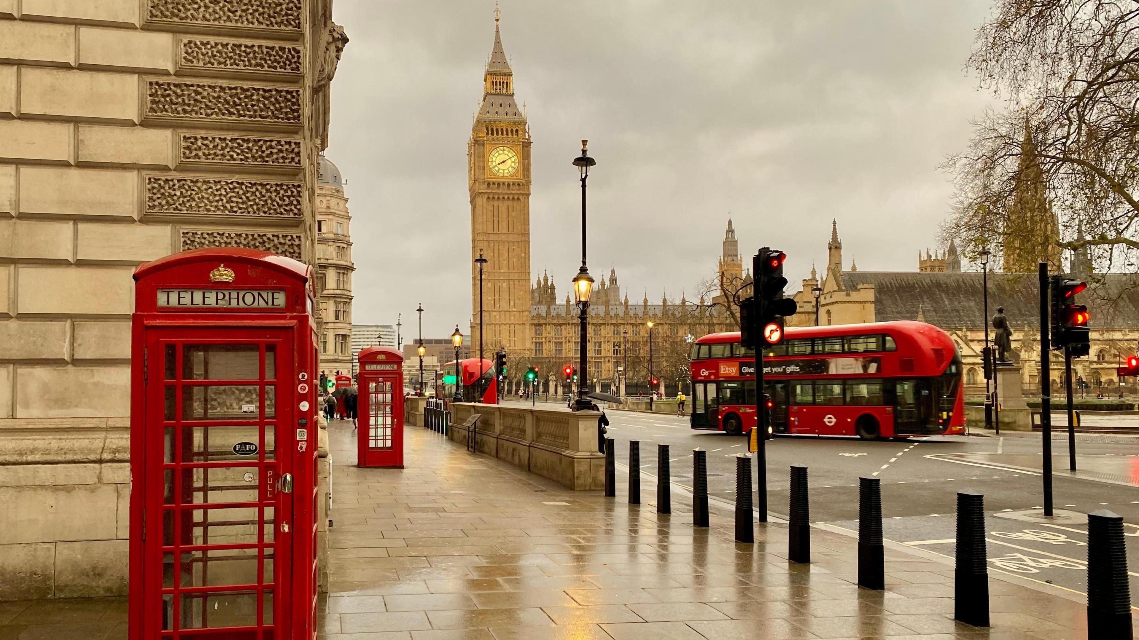 Grey clouds over Big Ben and London Bus in Westminster