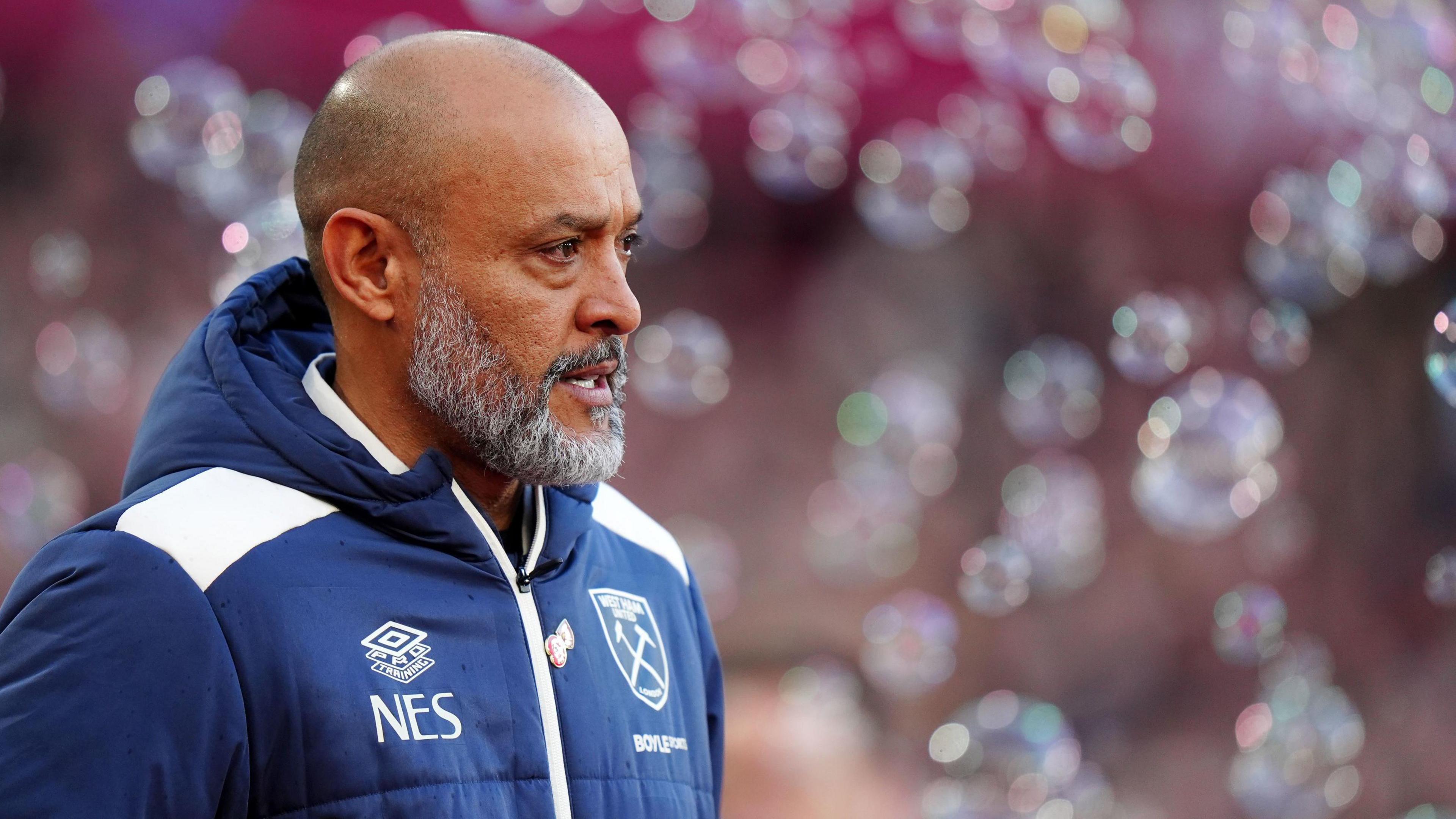 Nuno Espirito Santo with bubbles behind him