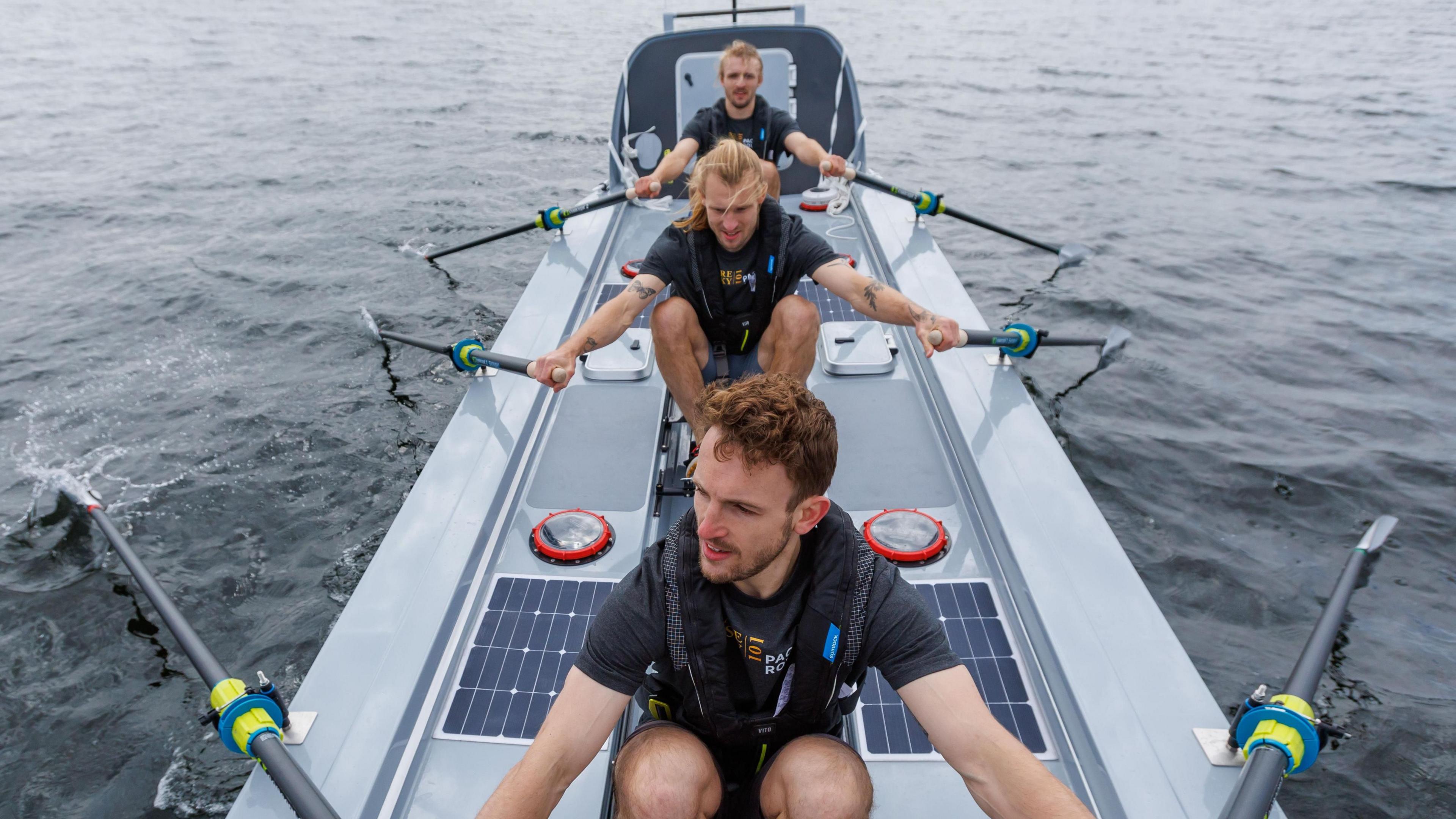 Jamie, Ewan and Lachlan MacLean rowing in their carbon fibre boat.