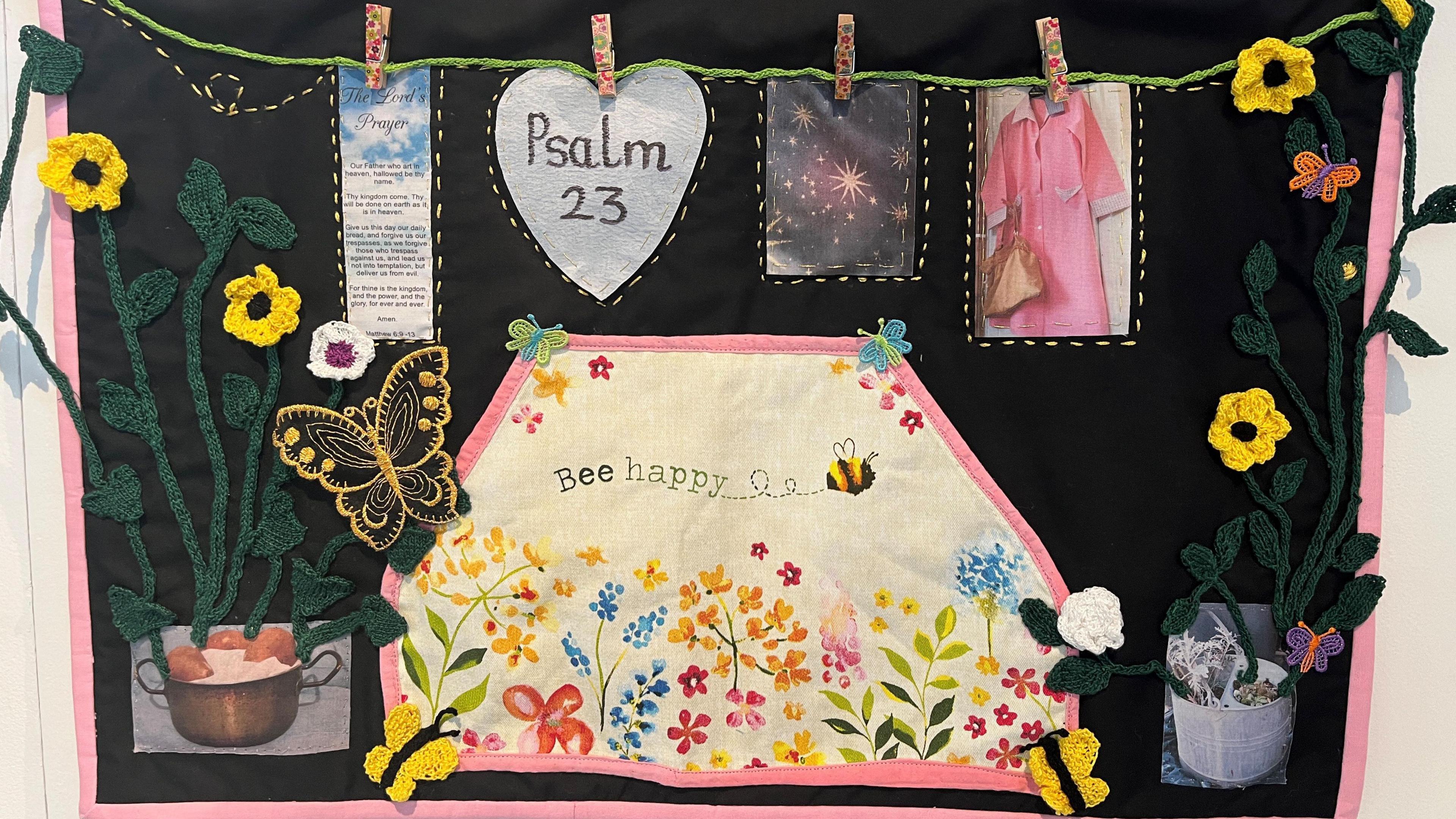 A quilt with a bed spread and washing line, plants and flowers