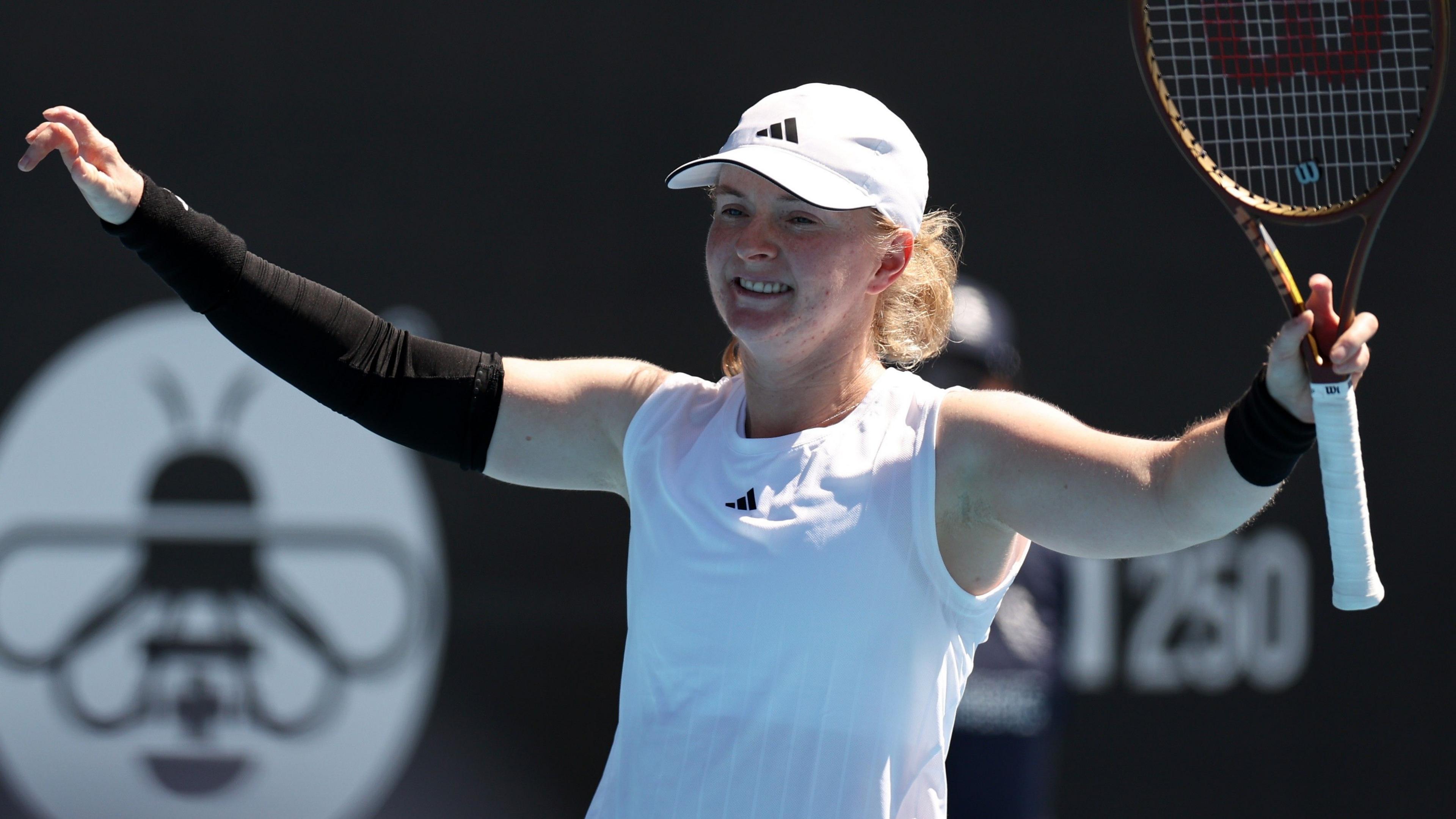 Francesca Jones raises her arms in celebration after victory at the Auckland Classic