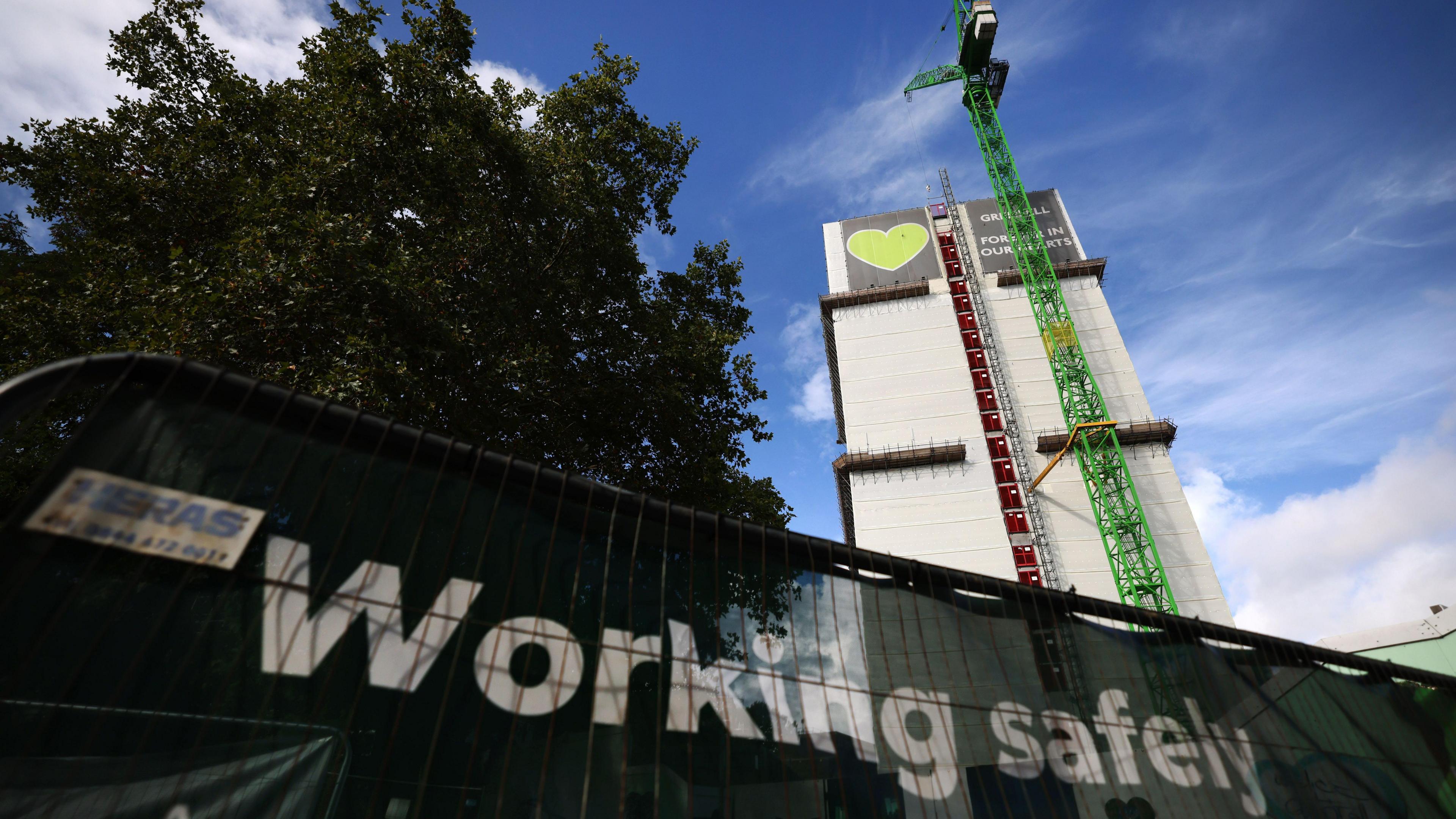 A crane is seen over the Grenfell Tower in west London where demolition work is set to get underway following the fire in 2017 that killed 72 people.