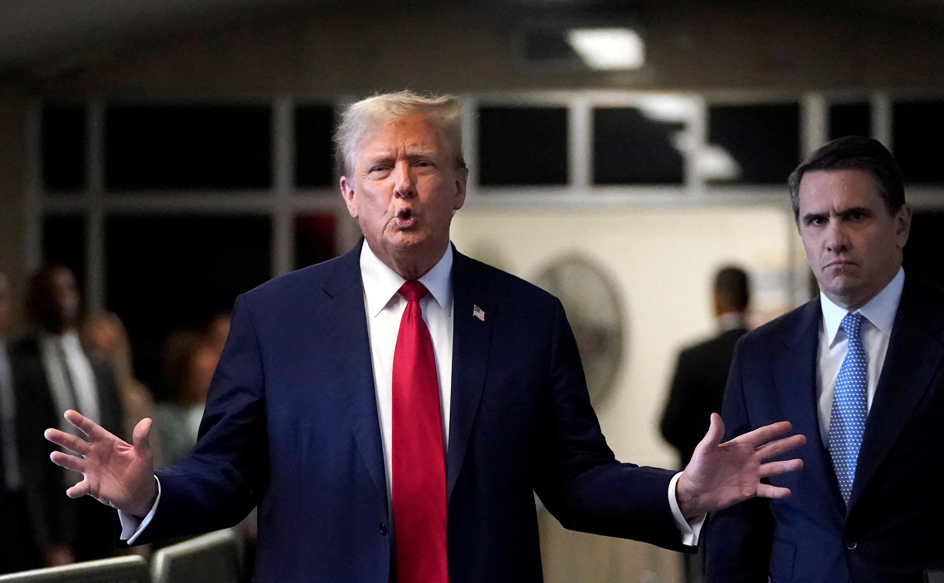 Donal trump outside a new york court talking to press