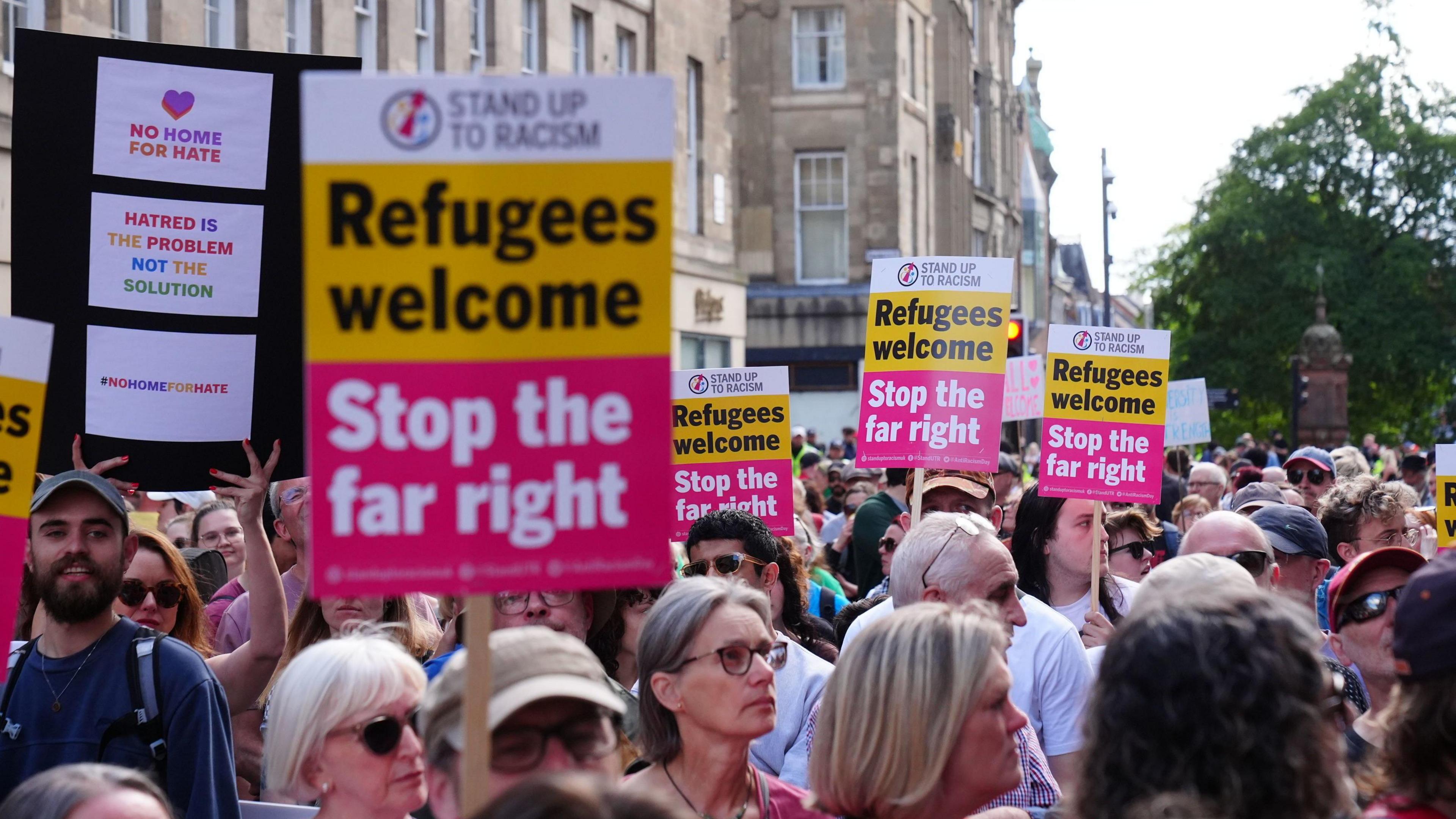 Hundreds of anti-racism protesters carrying banners and placards with various slogans such as 'refugees are welcome' gathered in Newcastle