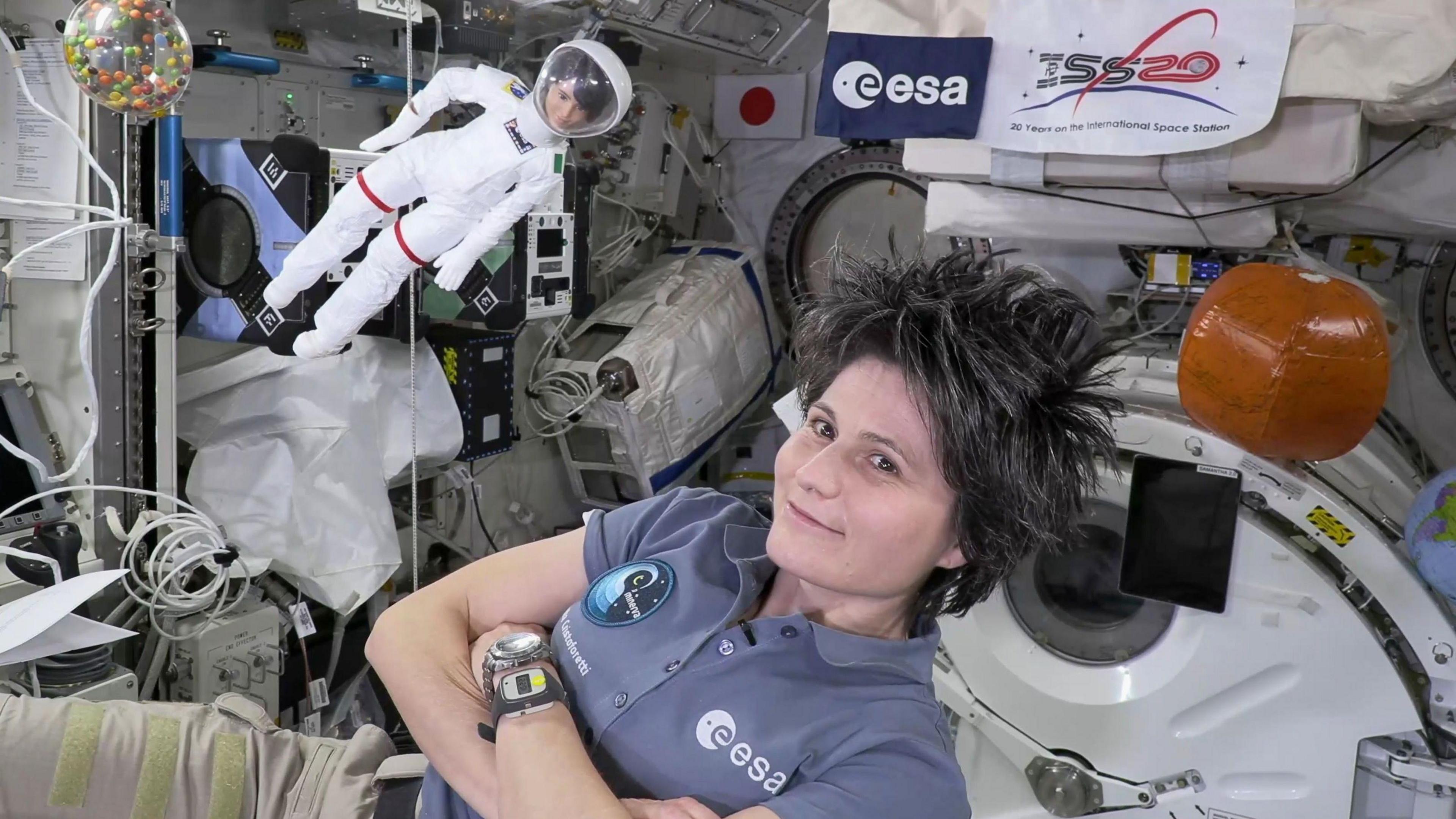 Barbie and astronaut Samantha Cristoforetti in space