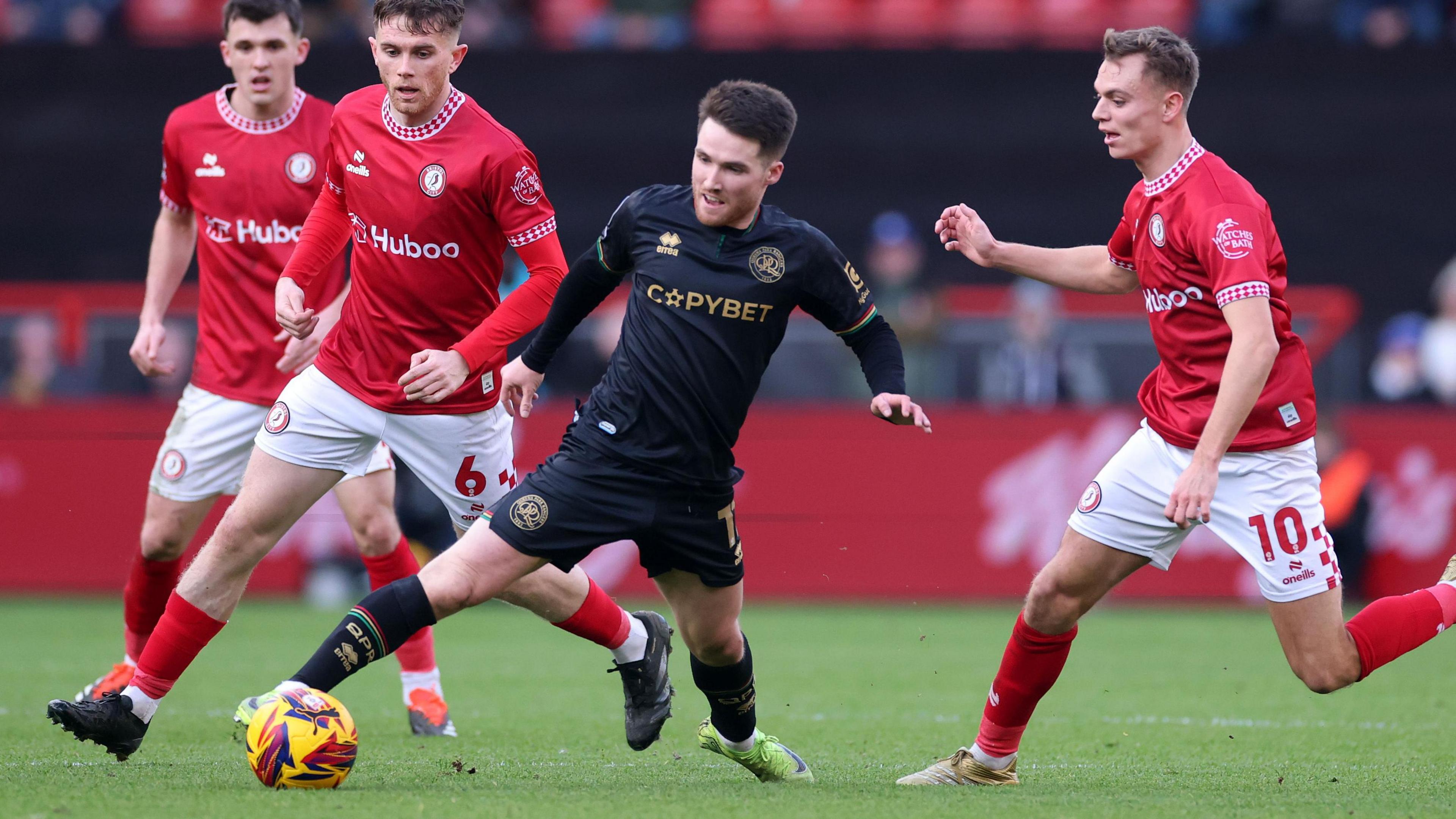 QPR's Paul Smyth is surrounded by Bristol City players