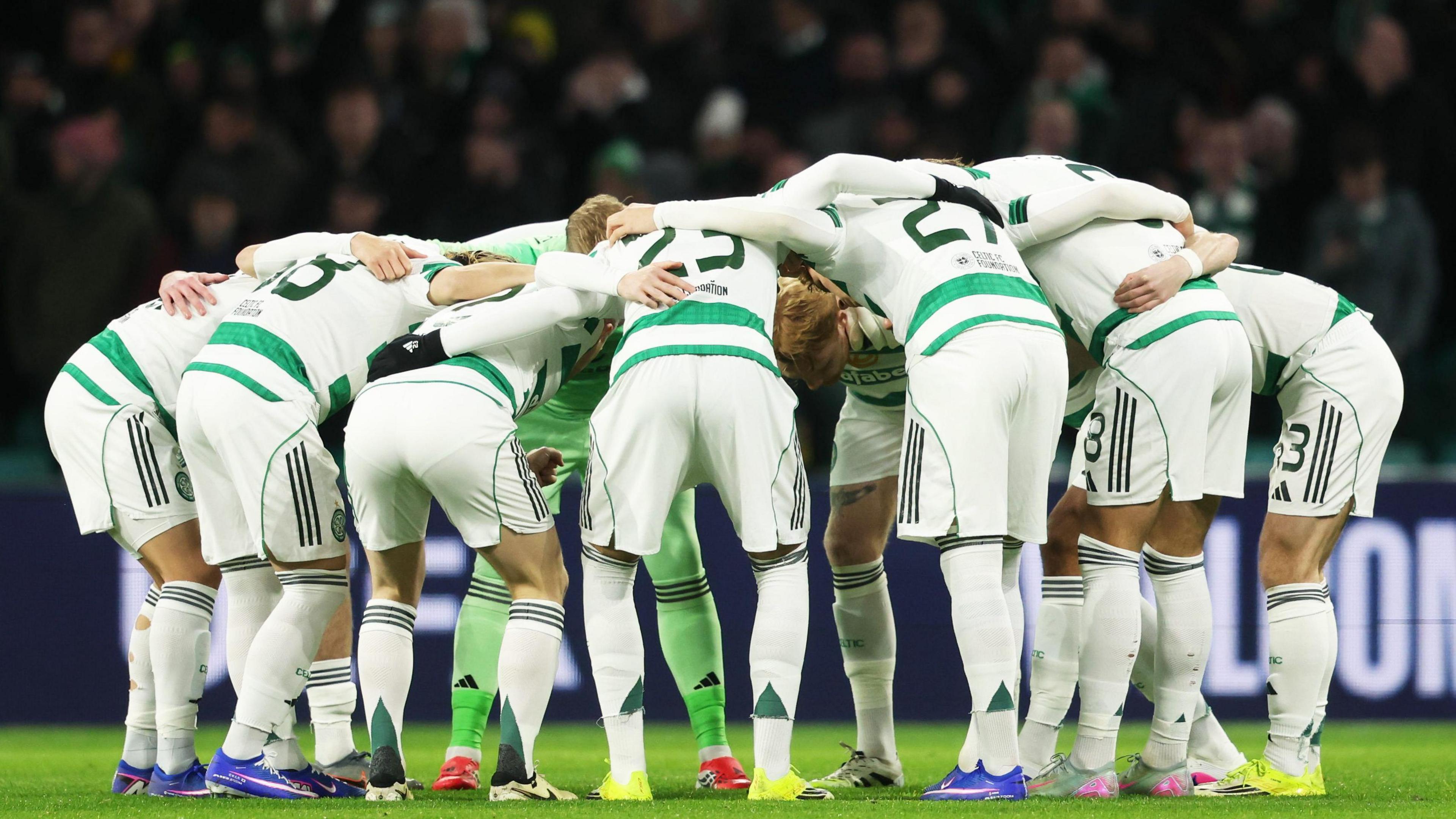 Celtic players join together in their pre-match huddle