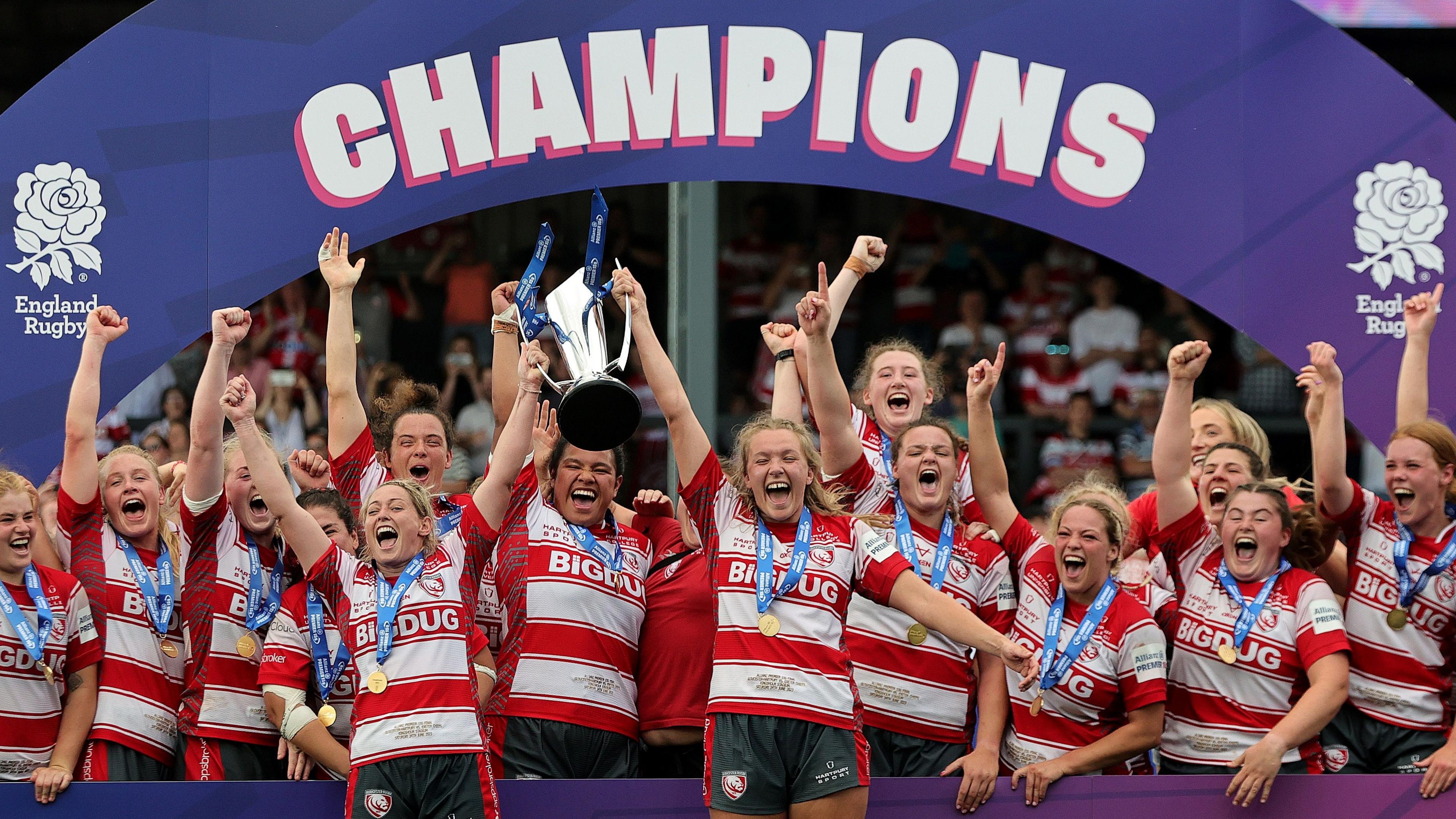 Zoe Aldcroft (R) and Natasha Hunt co captains of Gloucester-Hartpury lift the trophy after their victory during the Women's Allianz Premier 15s Final between Gloucester-Hartpury and Exeter Chiefs