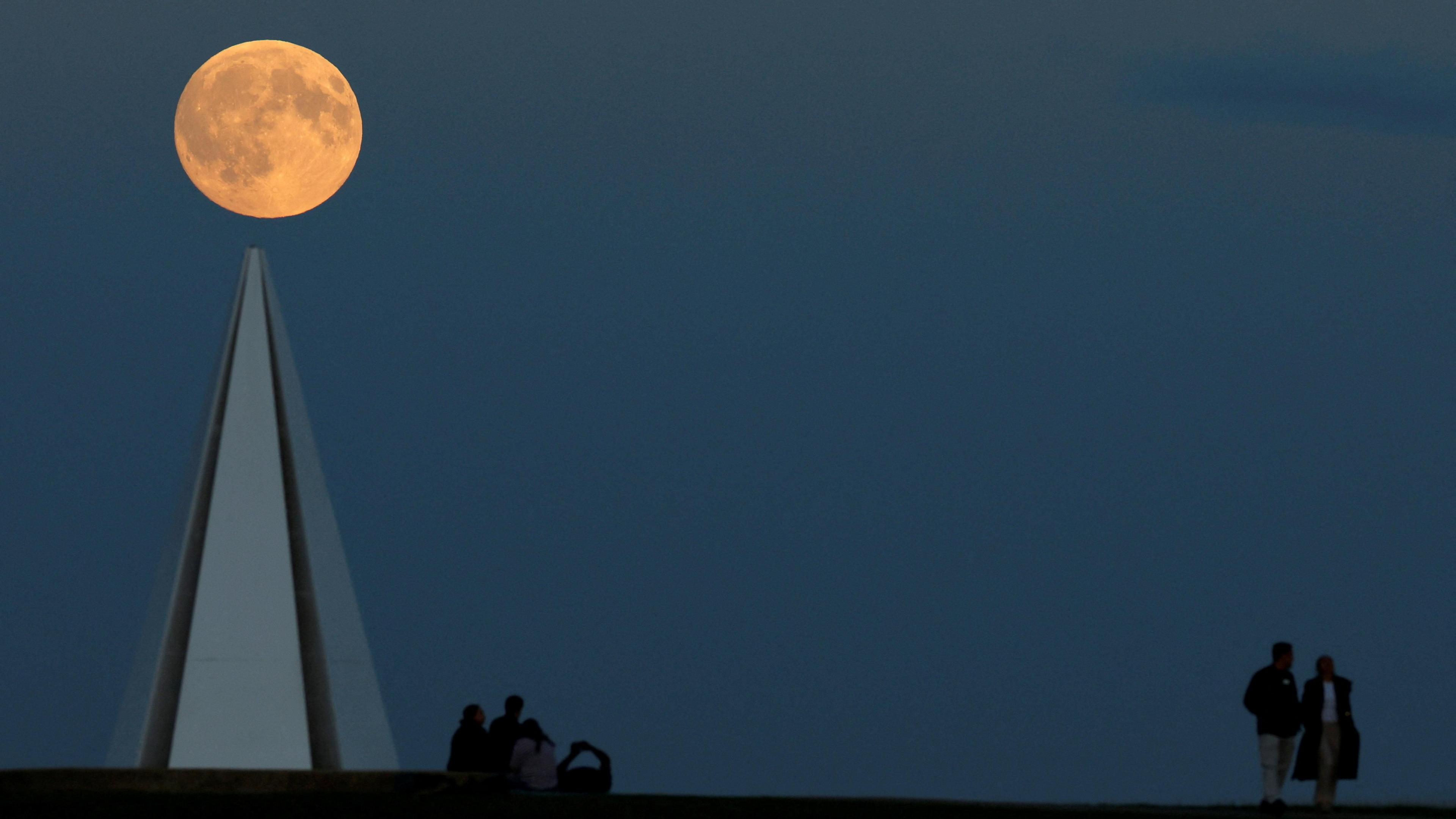 The supermoon perspective shot showing the moon on the tip of the Light Pyramid in Campbell Park, Milton Keynes.