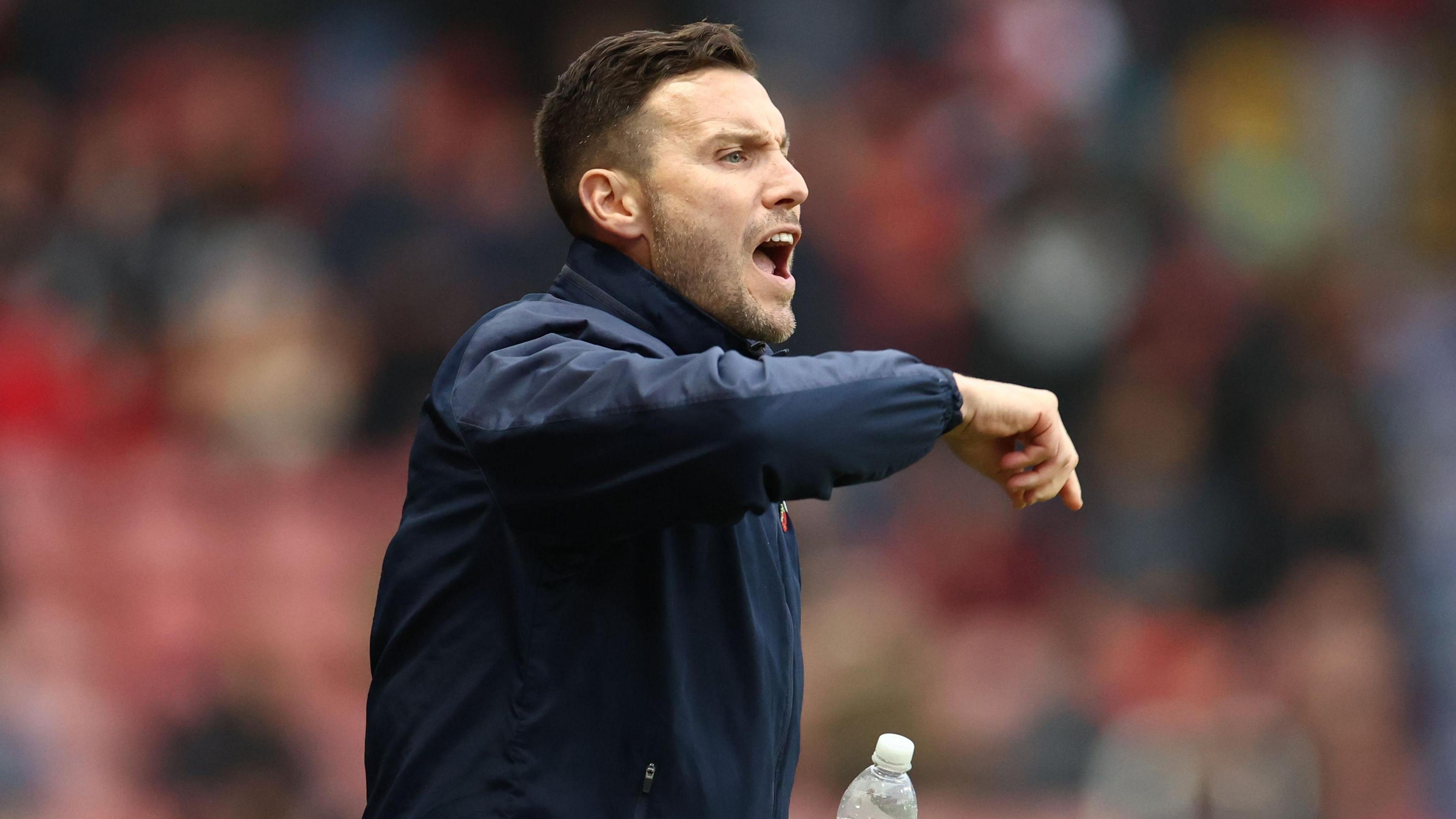 Walsall head coach Mat Sadler on the touchline against Colchester United