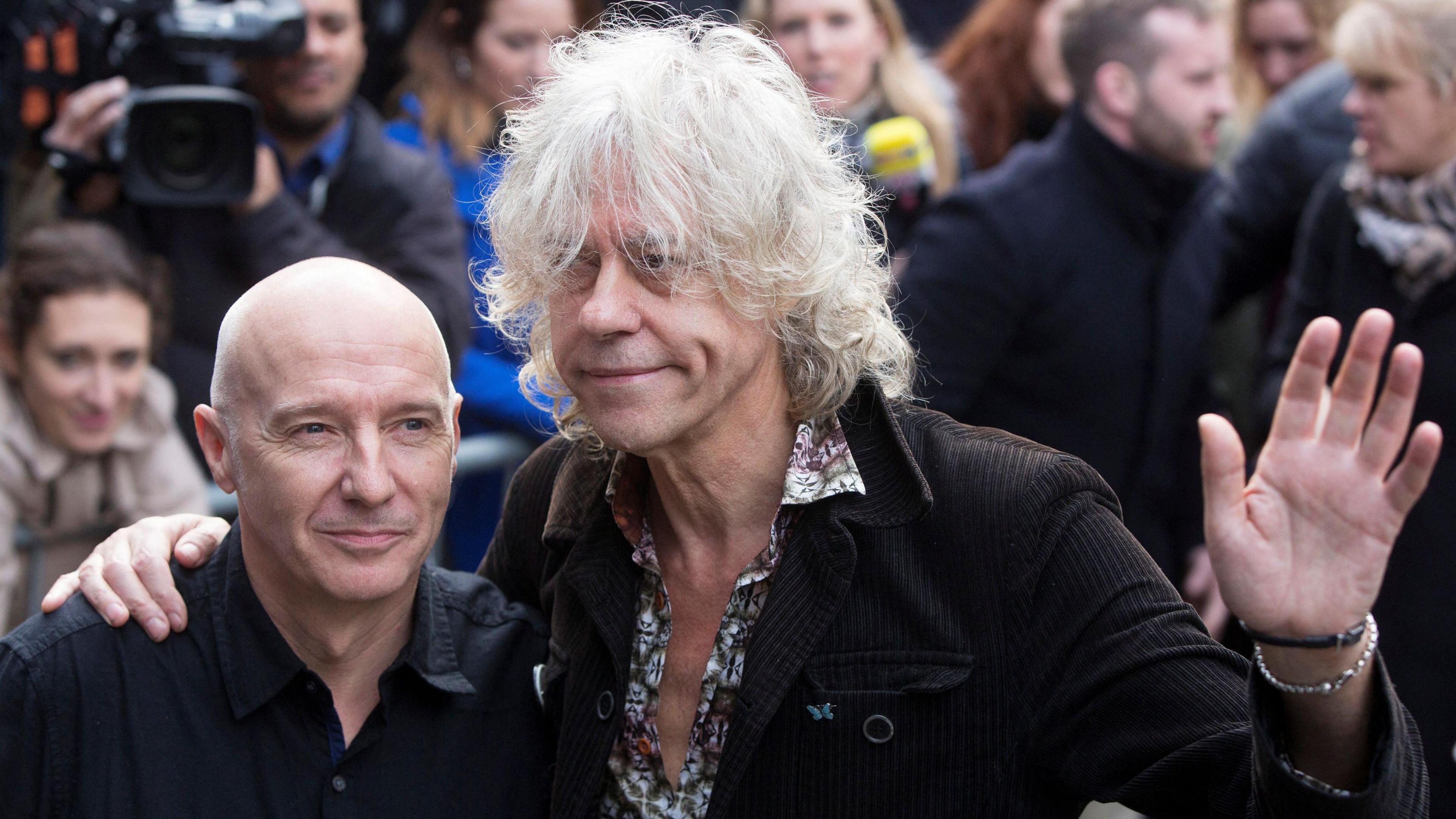 Midge Ure (left) and Sir Bob Geldof (right)