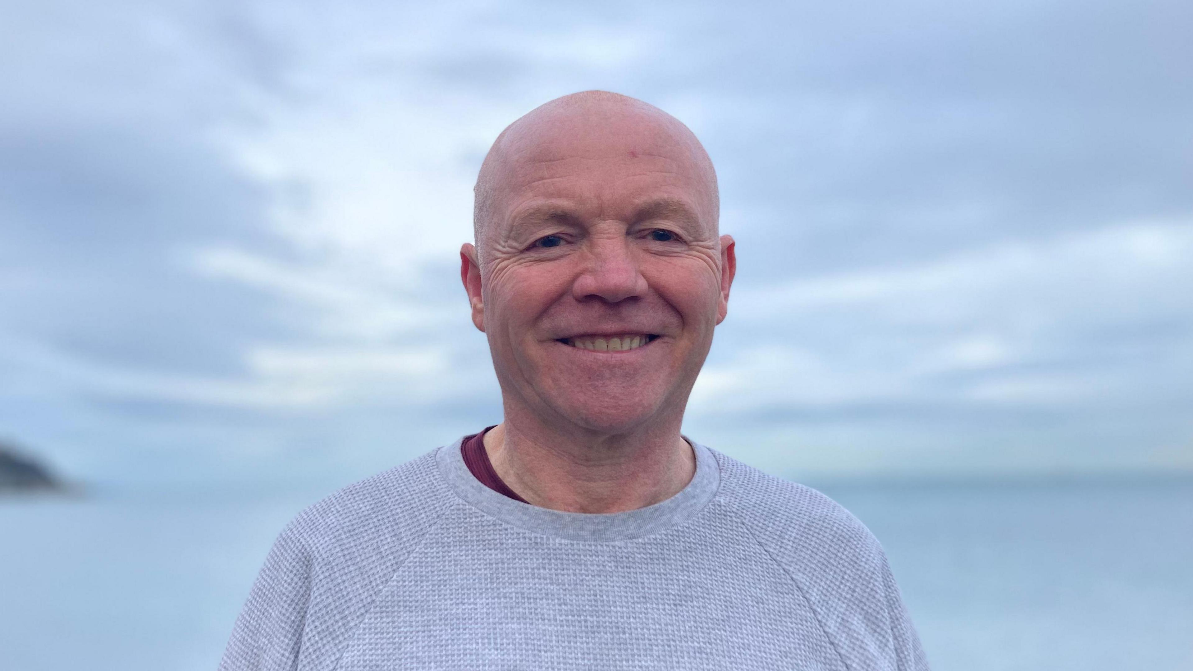 Martin Longmore smiling on Larne Promenade