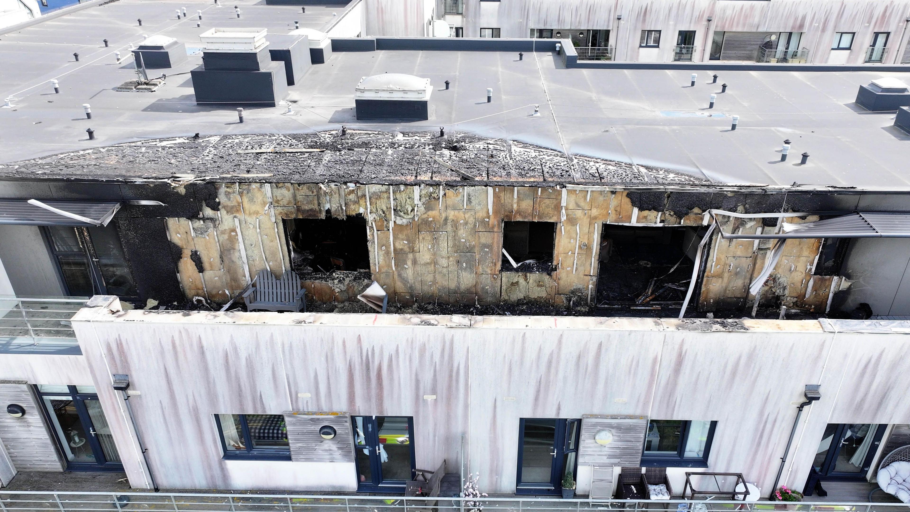 An aerial image showing damage to the roof