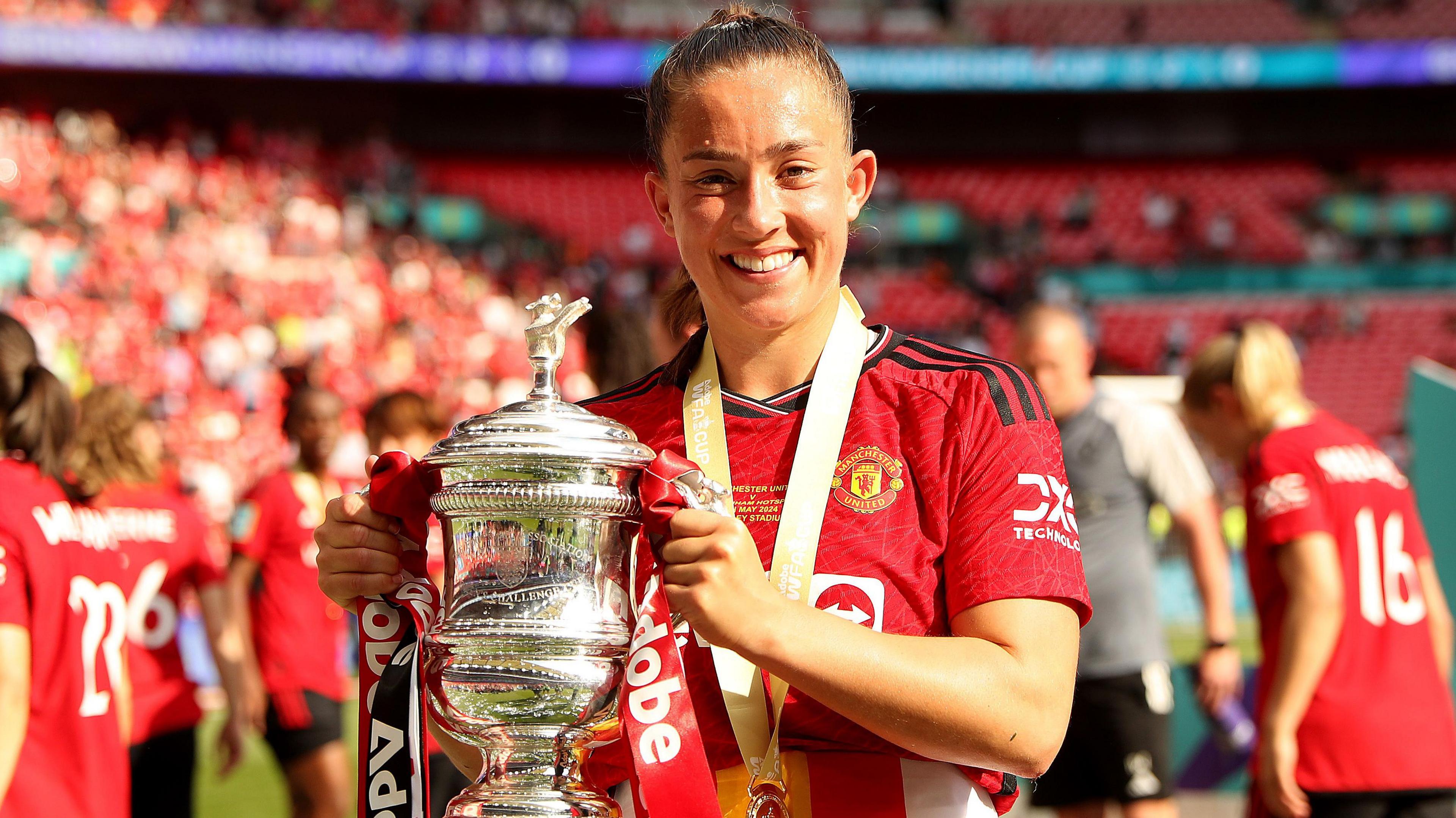 Maya Le Tissier hold the FA Cup at Wembley