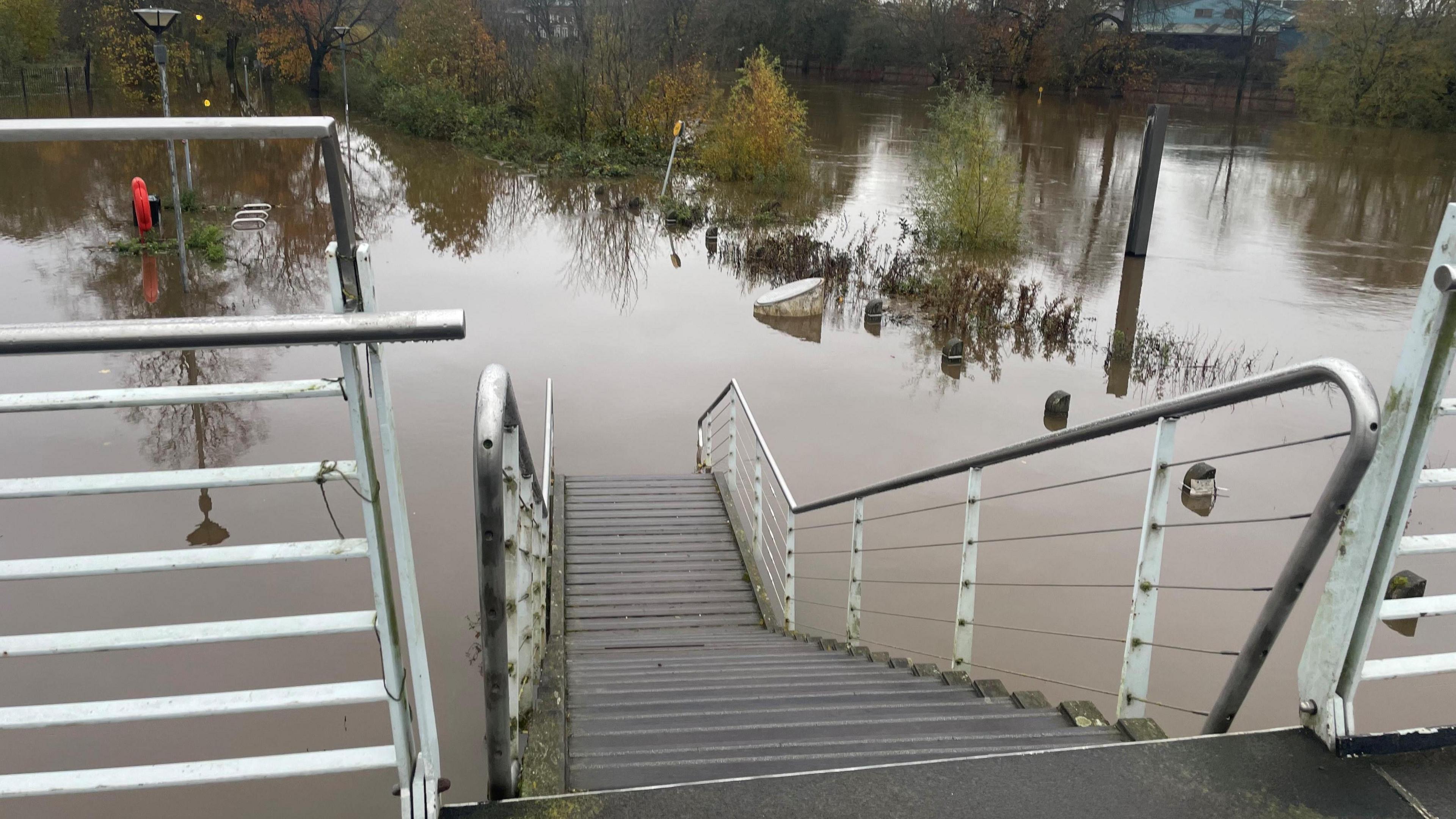 View from bridge with flood water beneath