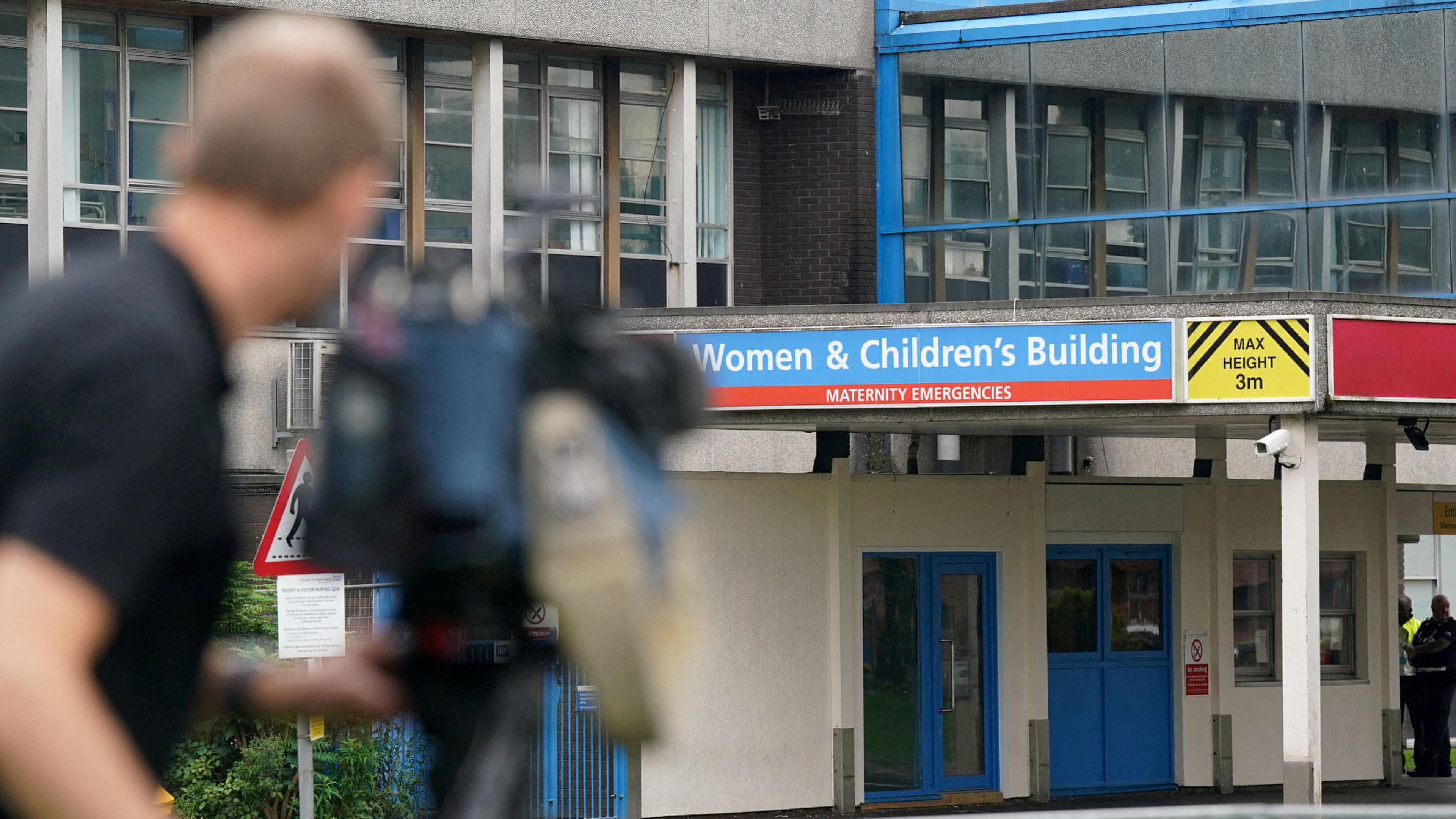 Cameraman filming outside the hospital