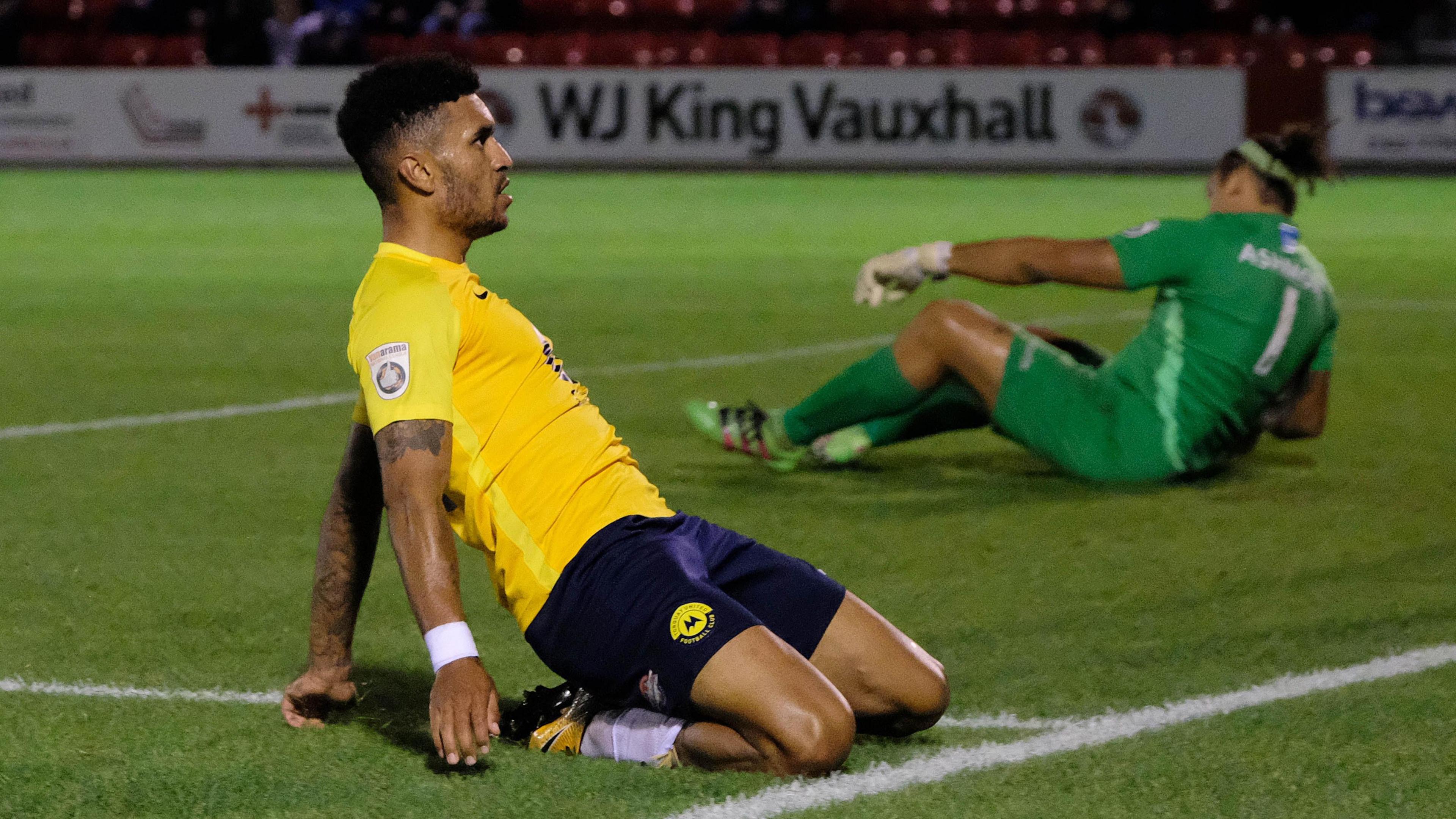 Jamie Reid slides on his knees by way of celebration after scoring for Torquay United against Ebbsfleet United in 2017