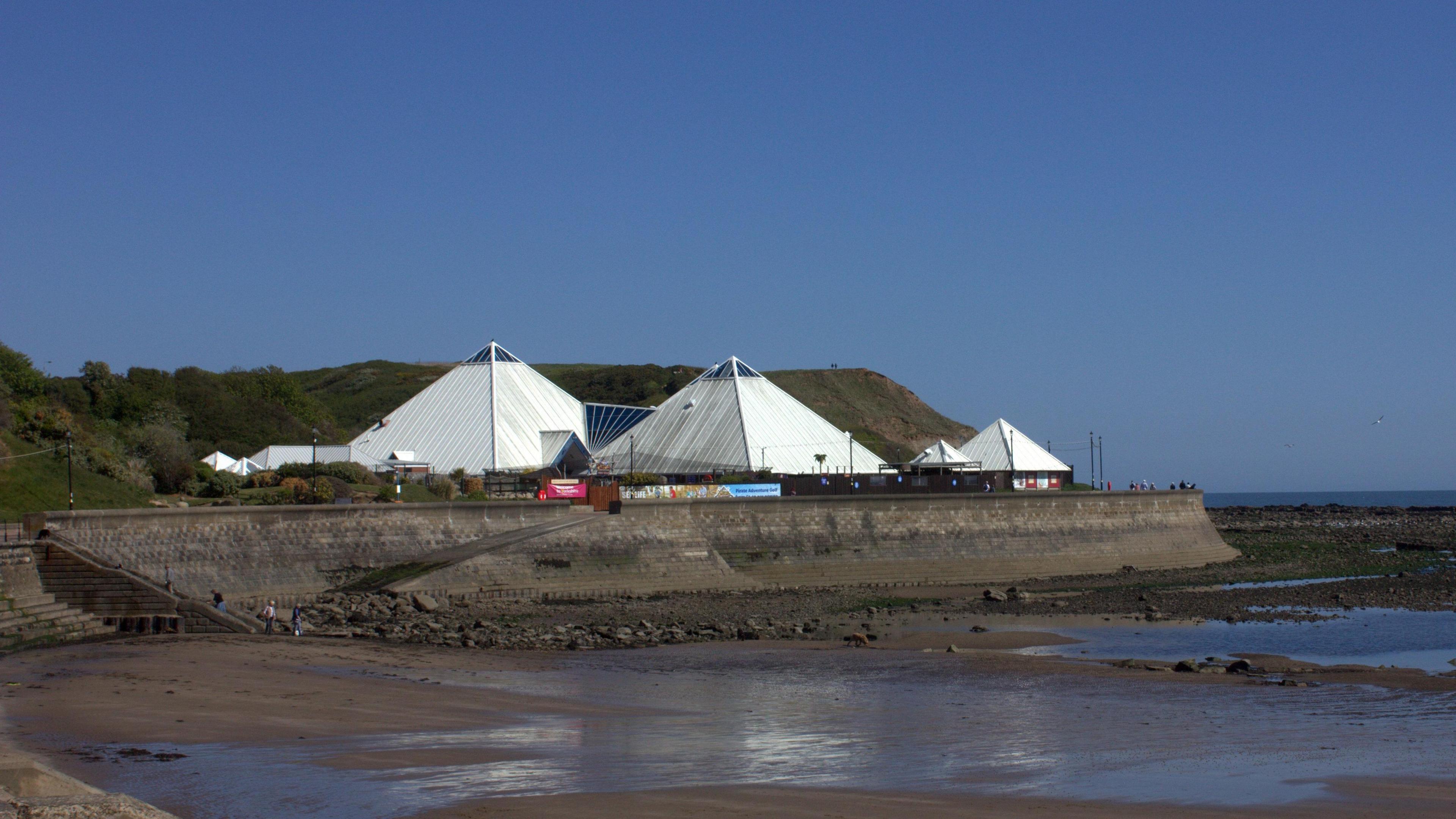 Scarborough's Sea Life Centre: white pyramid-shaped buildings facing the beach