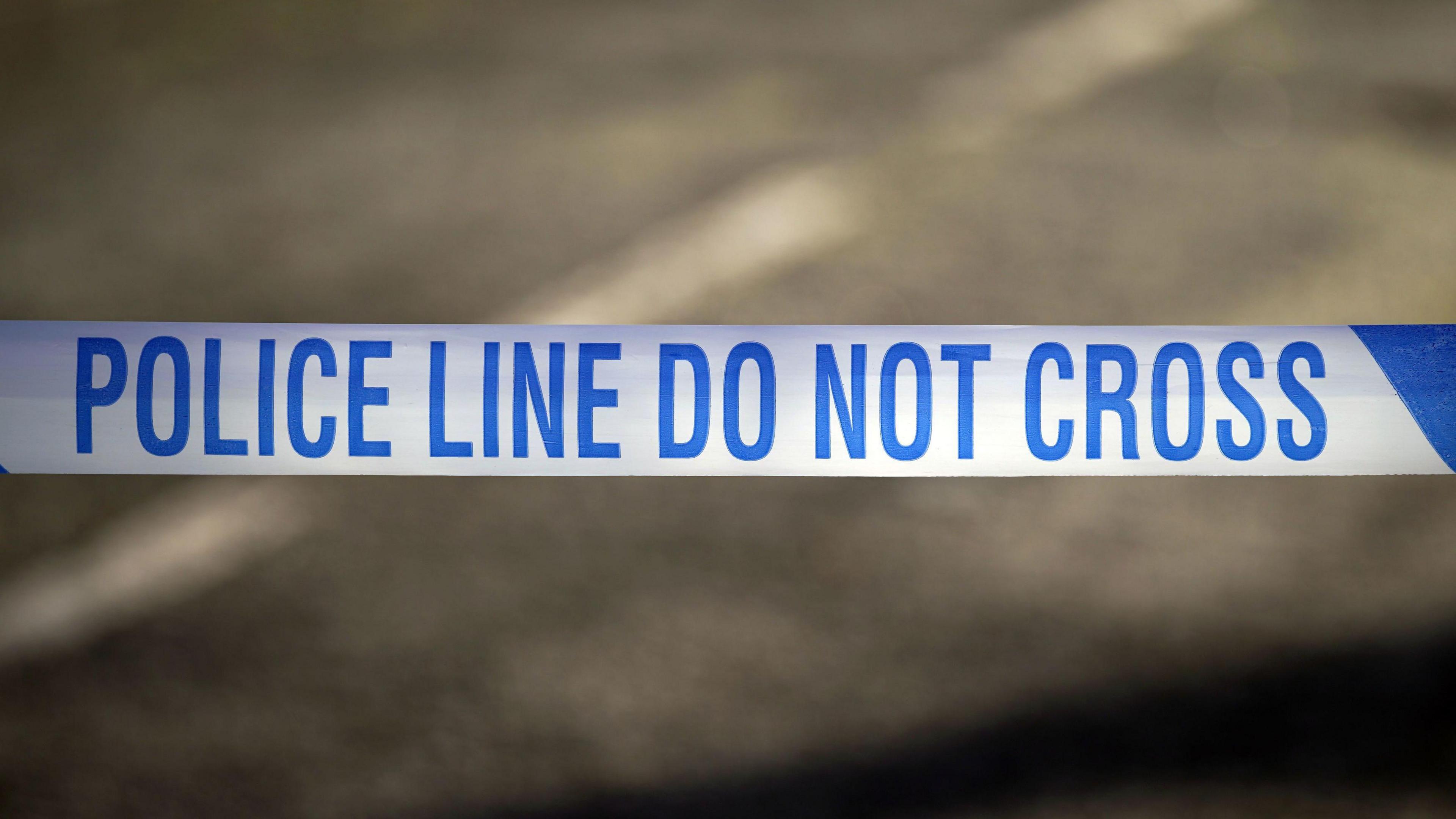 A general shot of blue and white police tape at a police incident