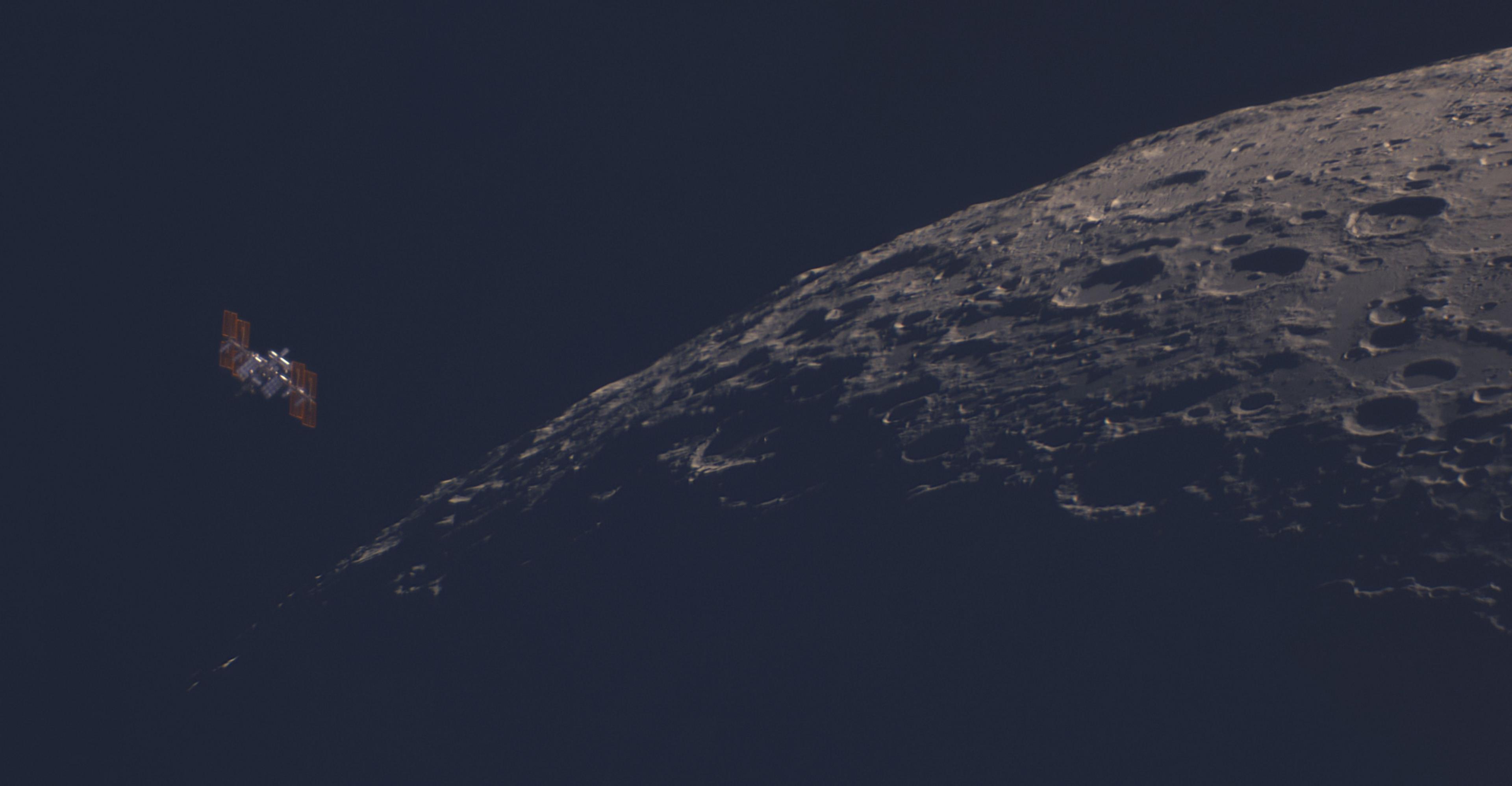 This image taken in Wiltshire in the UK shows the International Space Station making a close pass of the moon.