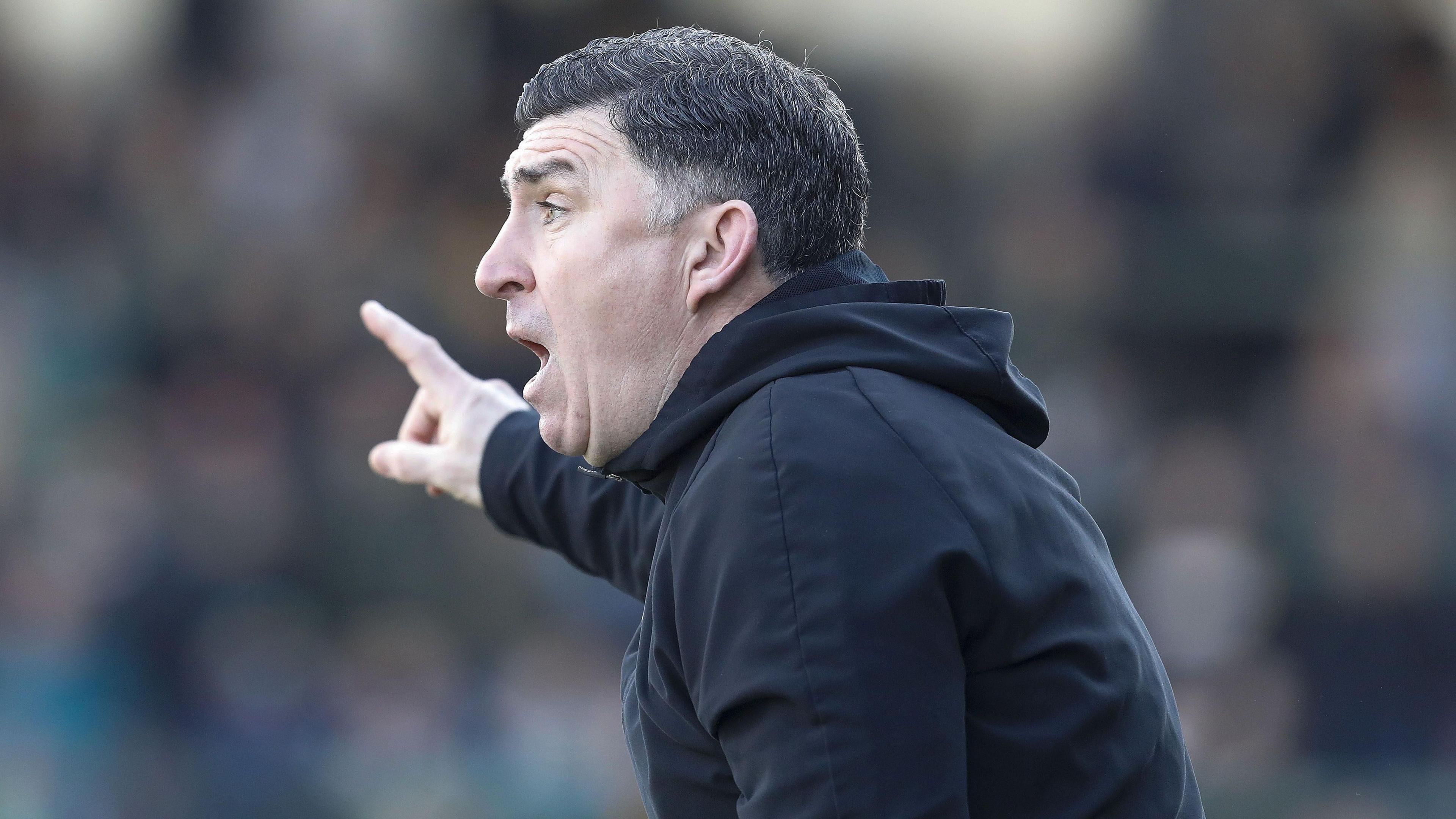 Southend United manager Kevin Maher points and shouts during his team's game against Yeovil Town