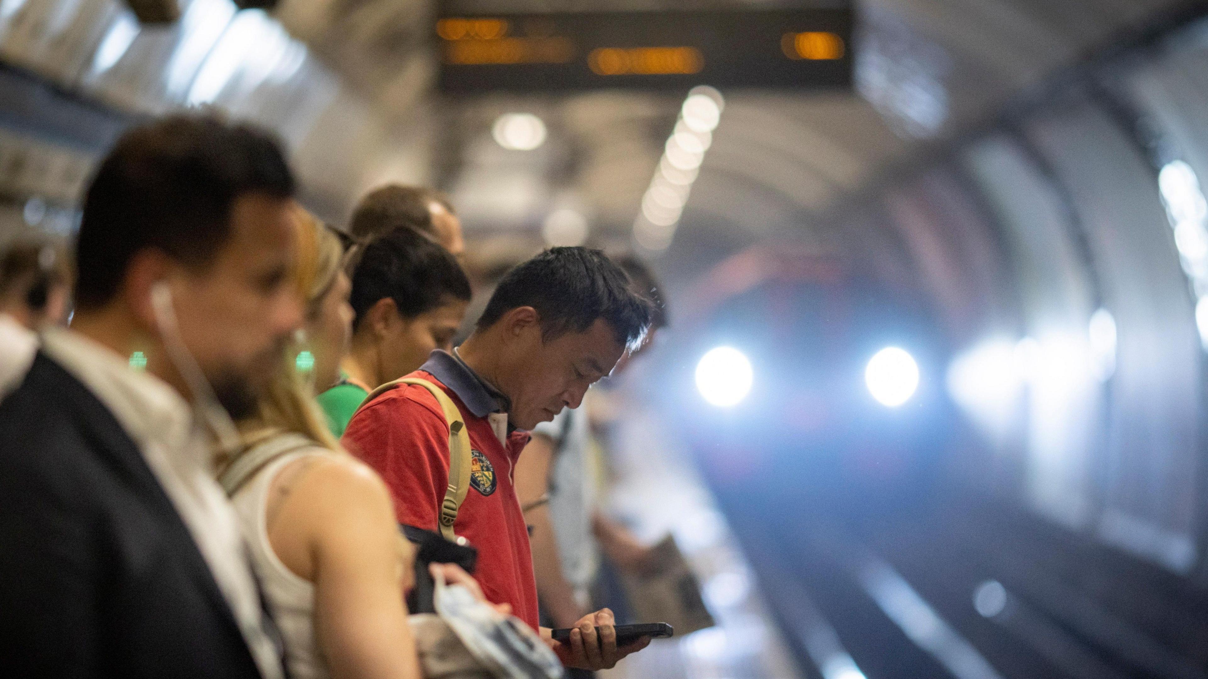 People waiting on the tube platform