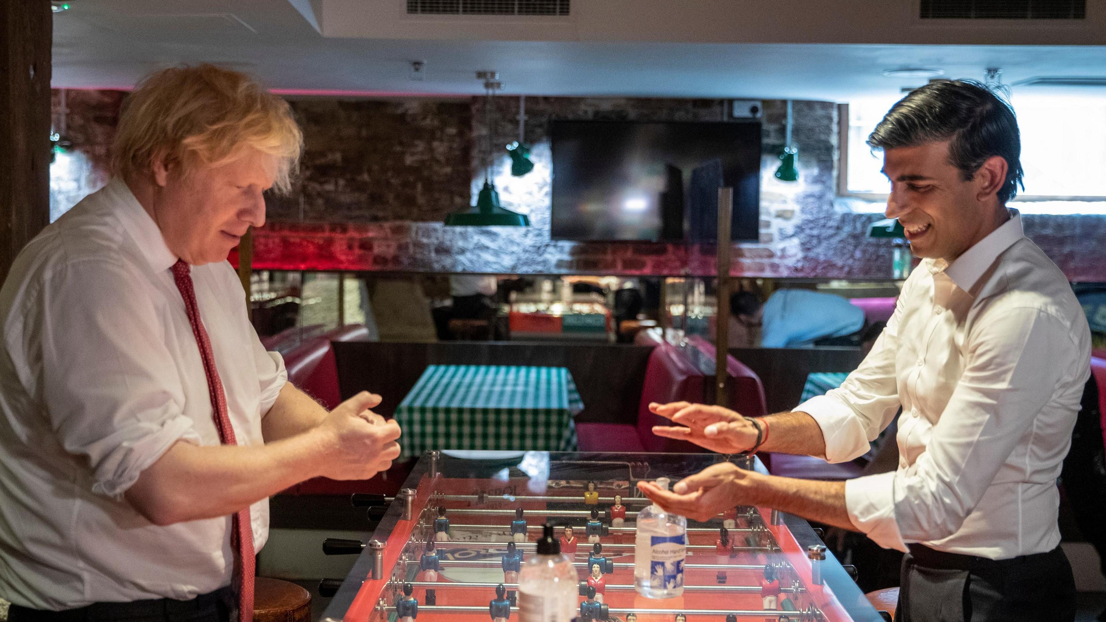 Then PM Boris Johnson and former Chancellor of the Exchequer Rishi Sunak  using hand sanitiser during a visit to the Pizza Pilgrims restaurant in east London during the Covid pandemic in 2020