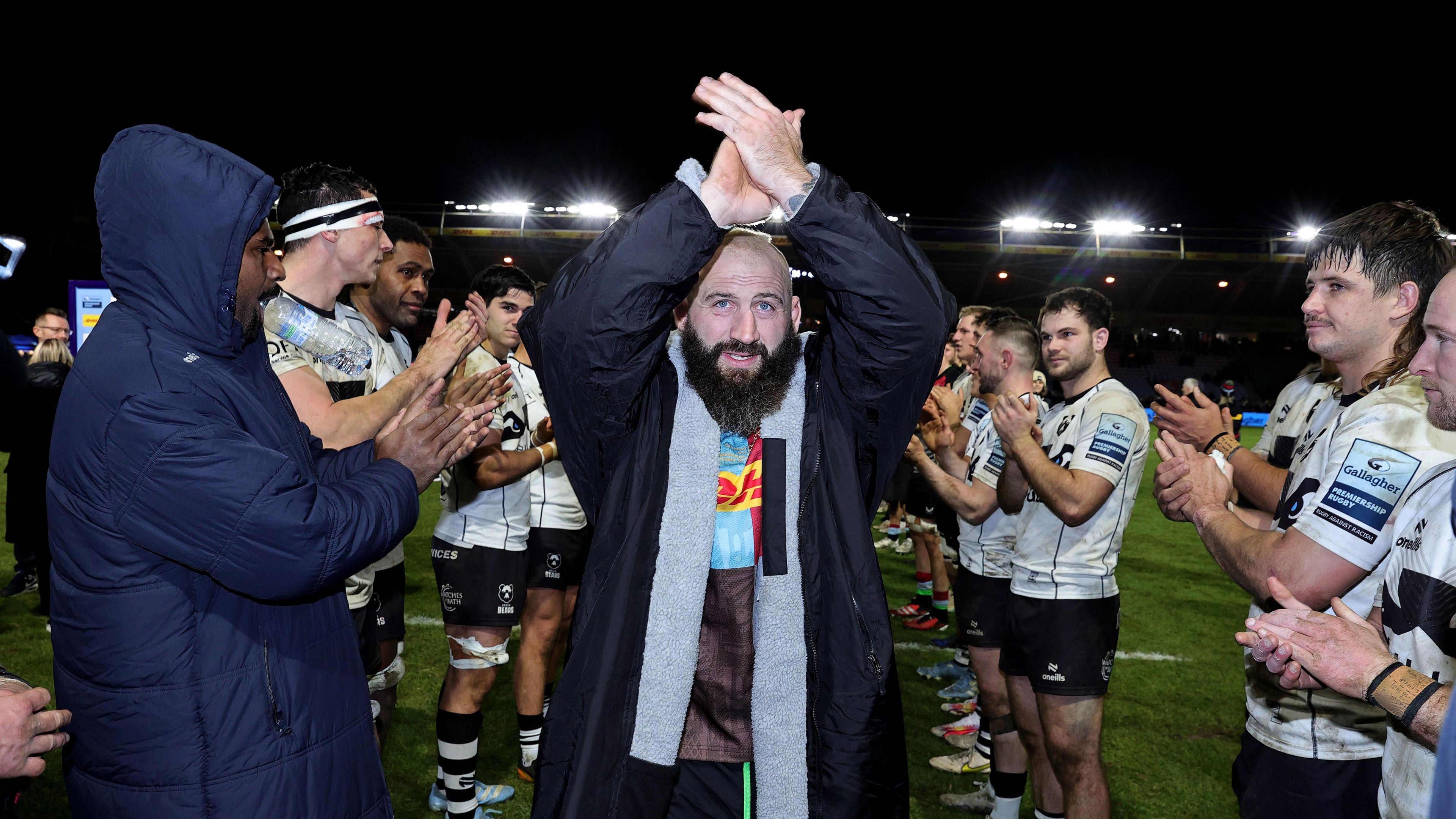 Joe Marler being applauded off the pitch after his final Harlequins game, walking through a guard of honour