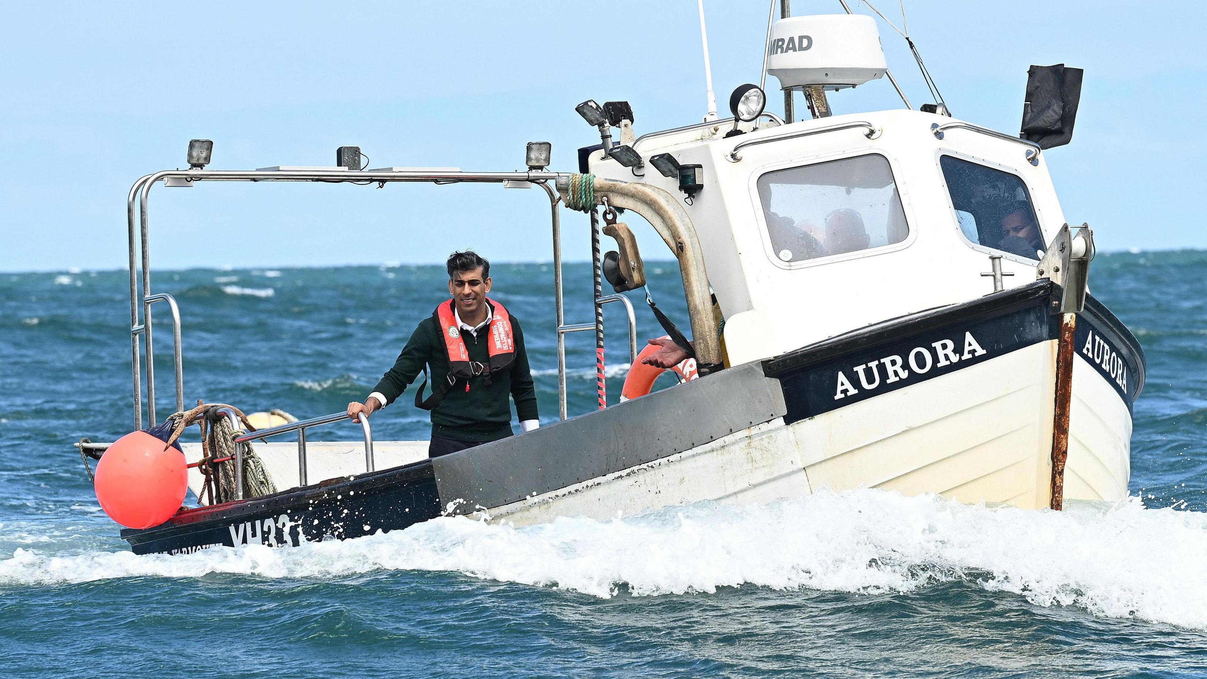 Prime Minister Rishi Sunak on a boat in Clovelly on 18 June