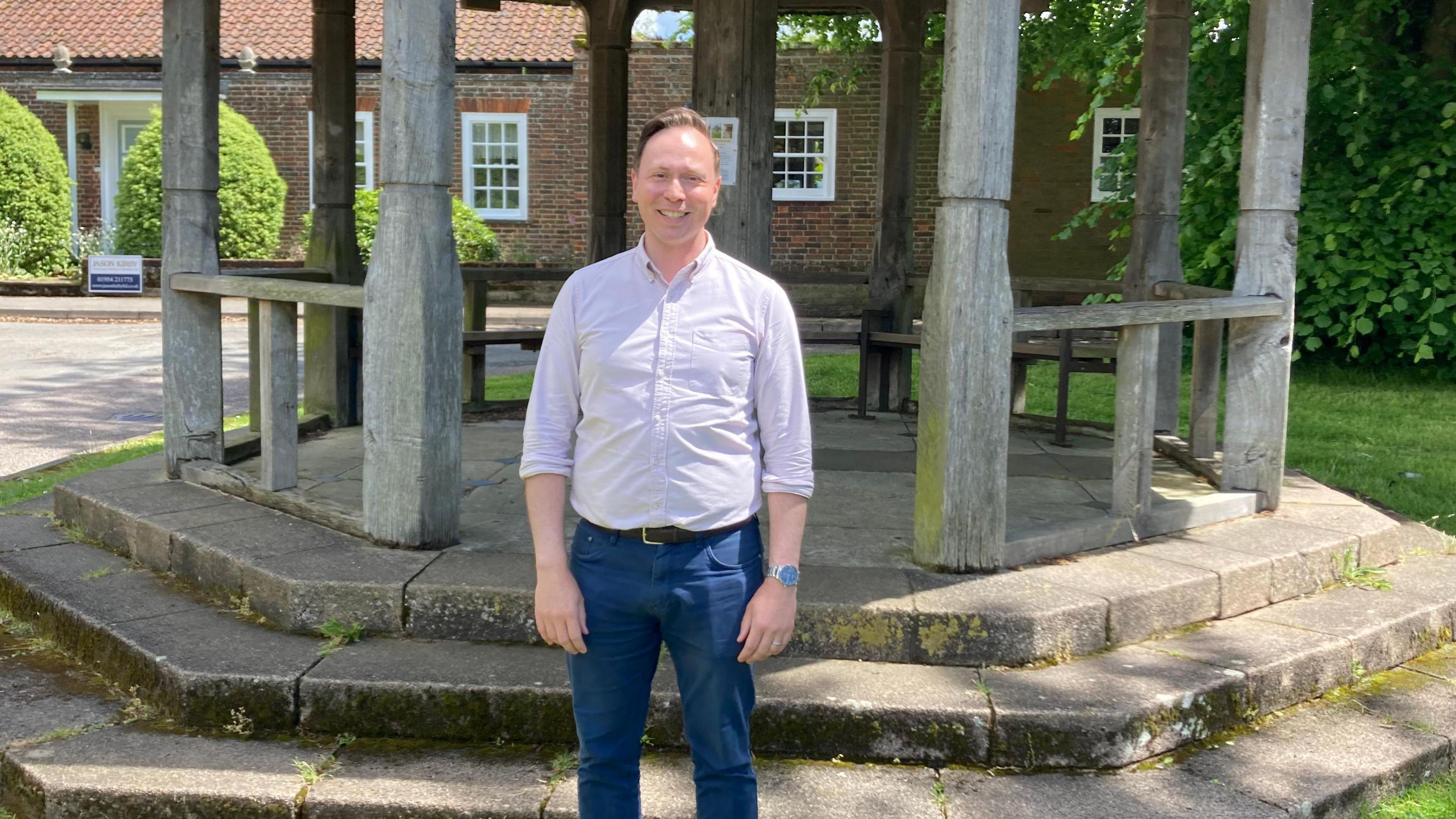 Chris Carter-Chapman standing in front of a bandstand