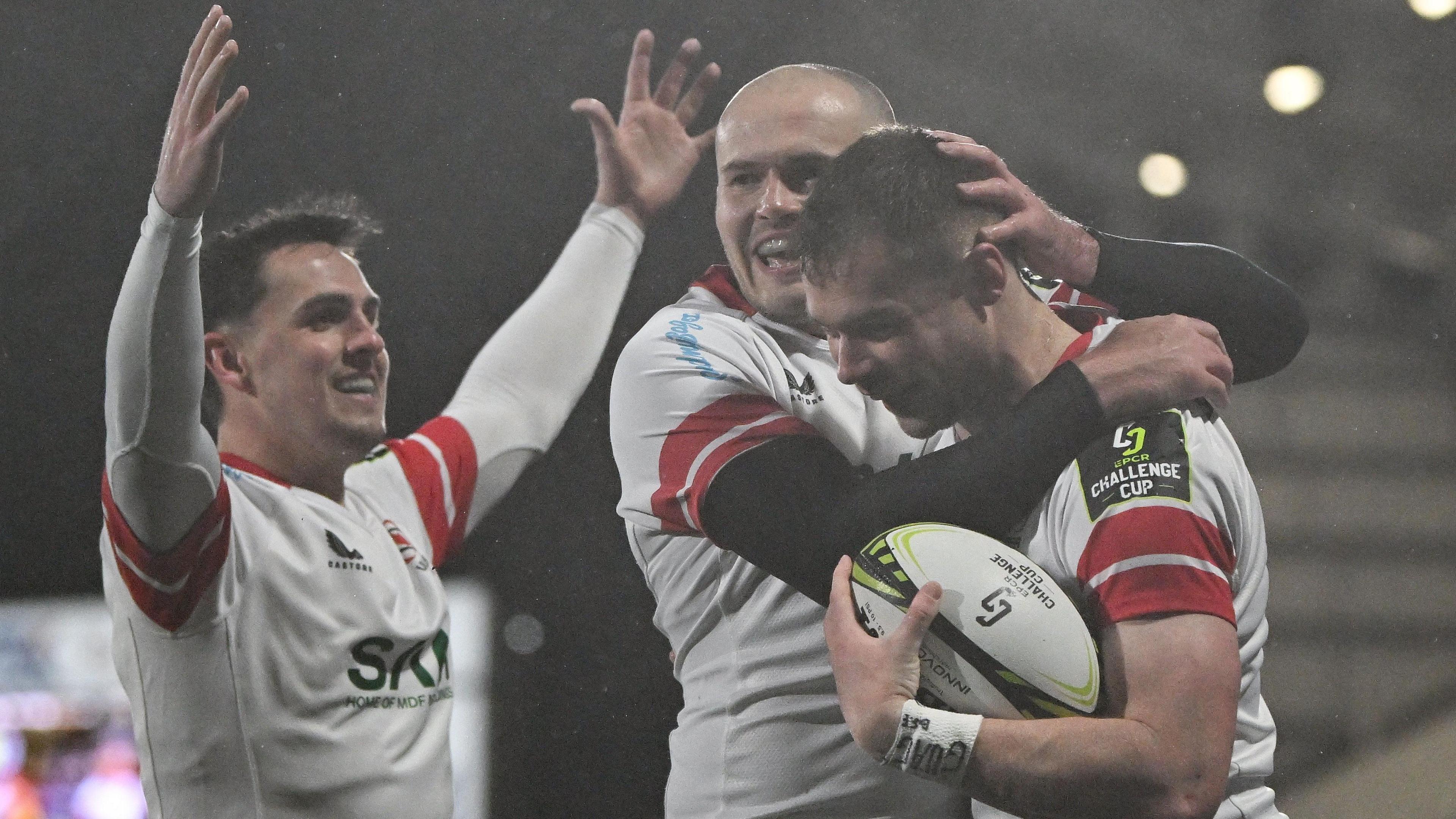 James Hume celebrates with Jacob Stockdale and Zac Ward