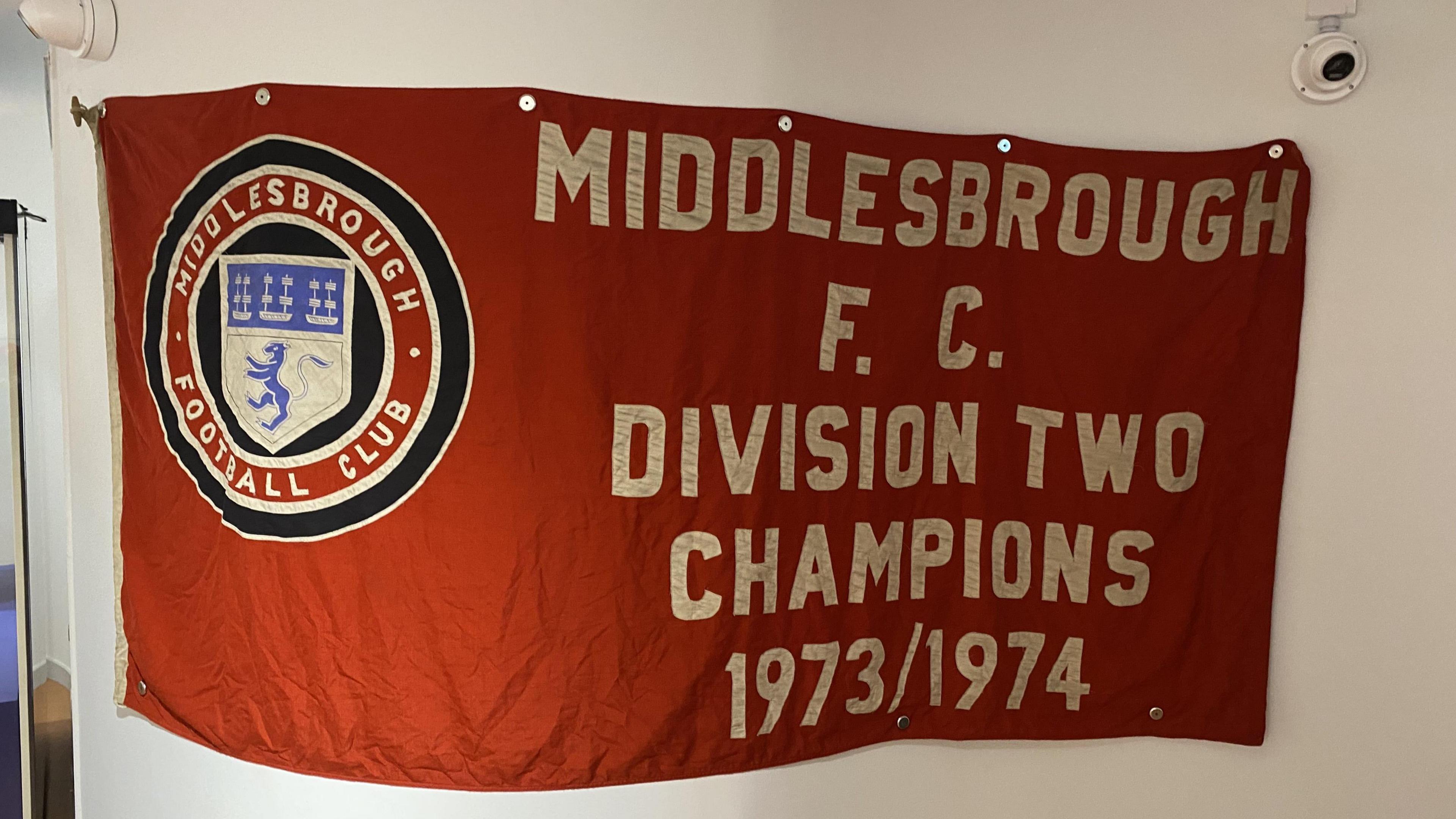 A flag showing the Middlesbrough FC badge. It displays the words "Middlesbrough FC Division Two Champions 1973/1974".