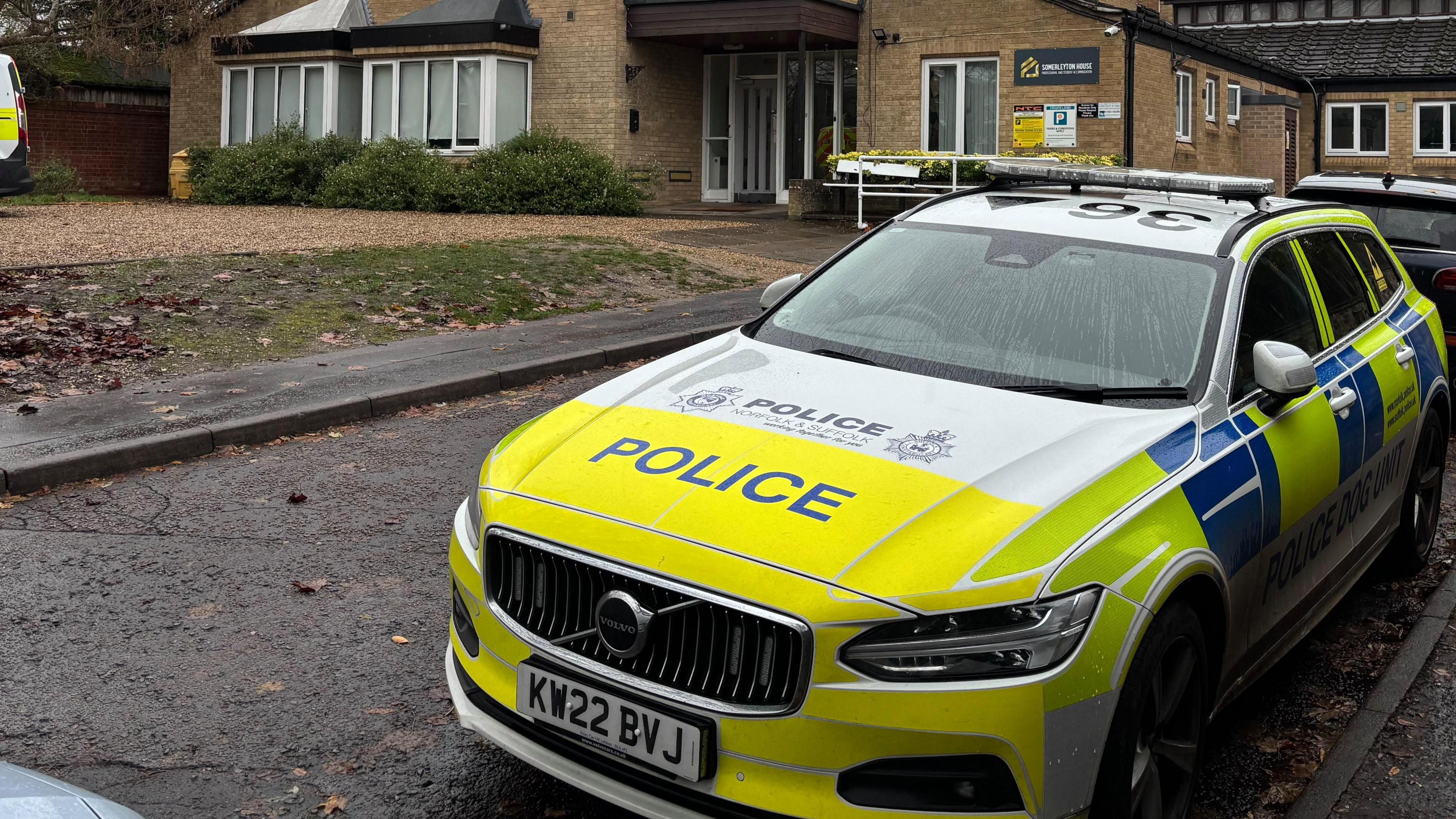 A police car is parked on Somerleyton Street in Norwich. It is parked in front of Somerleyton House, an accommodation block. To the left of the picture is a white police forensics van.