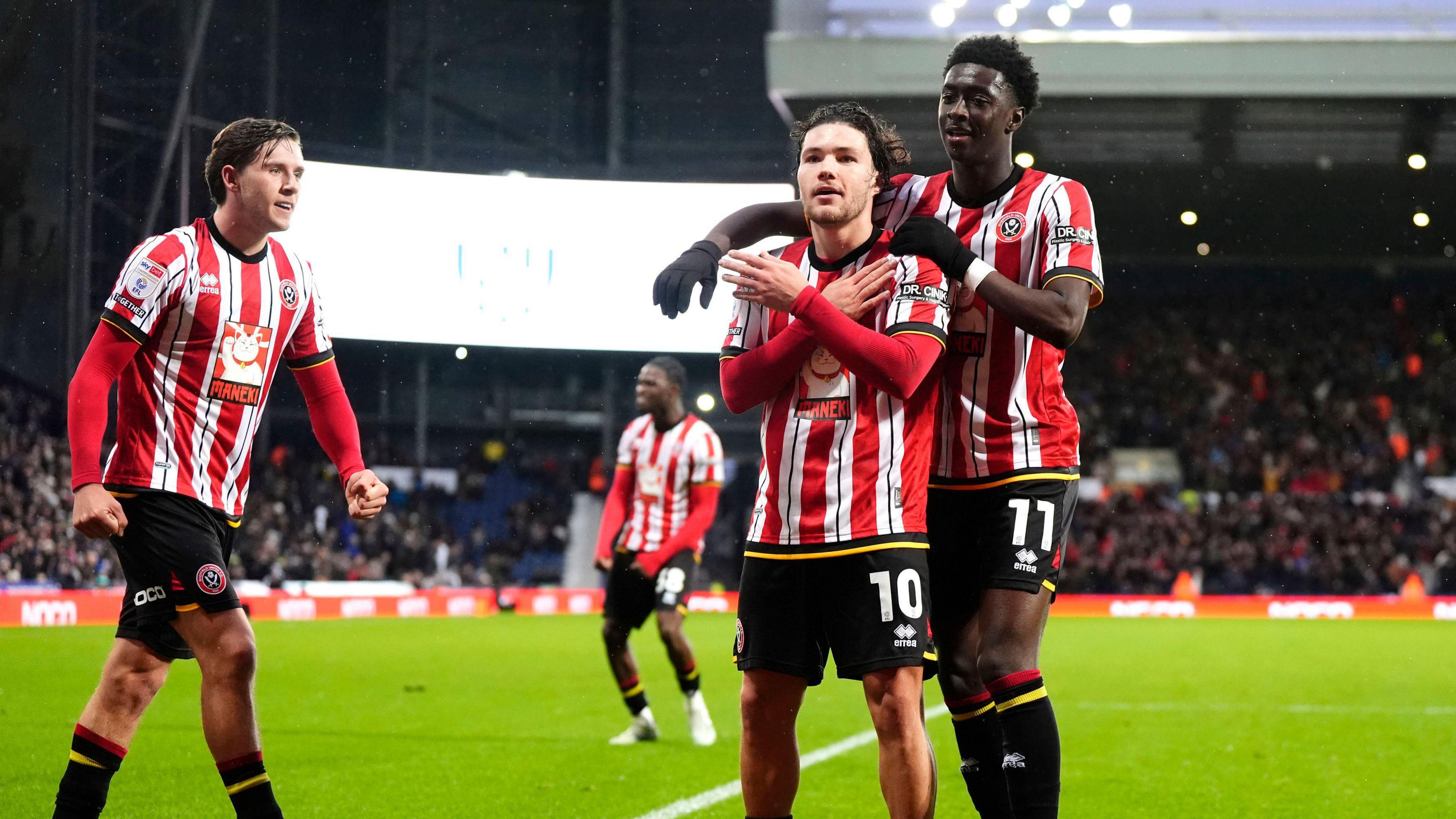 Callum O'Hare celebrates his first-half equaliser for Sheffield United at a rain-lashed Hawthorns