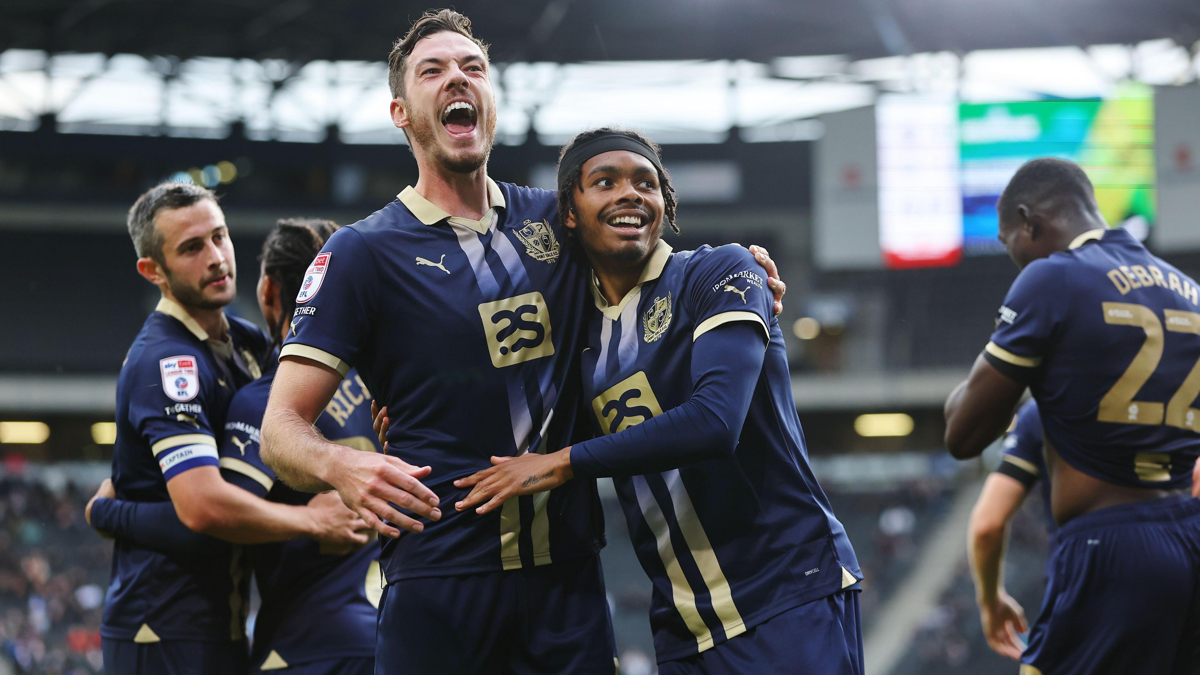 Port Vale players celebrate winning at MK Dons