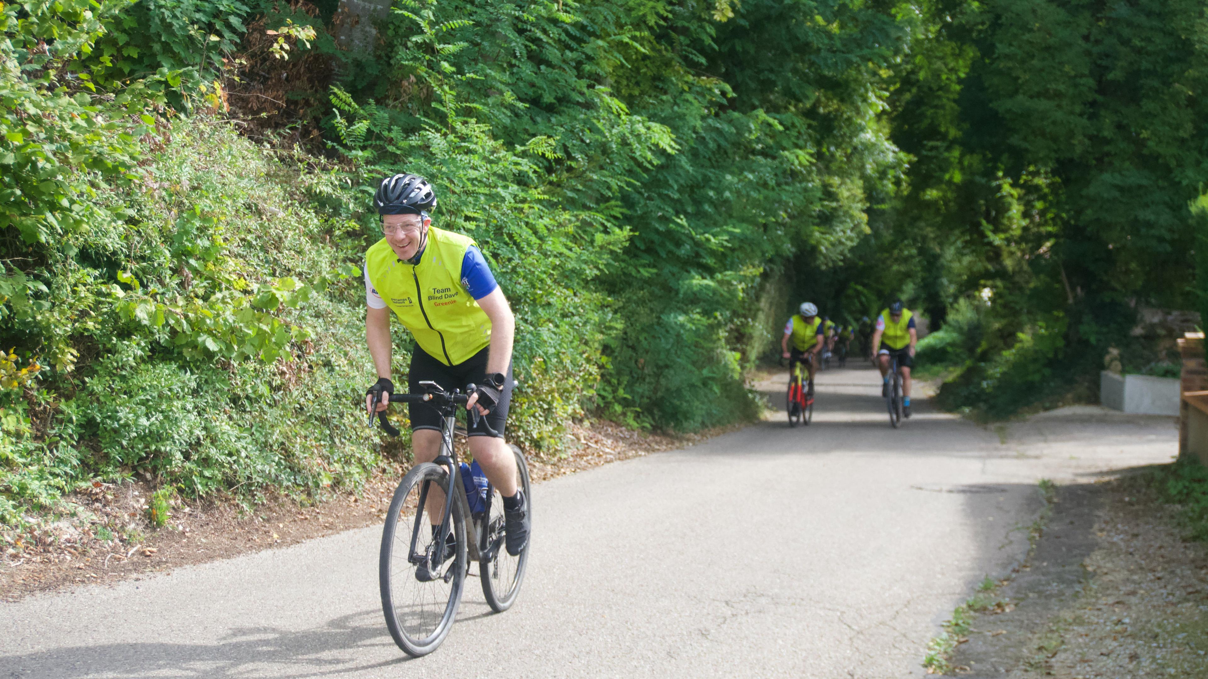 A man riding a bicycle on a road in France